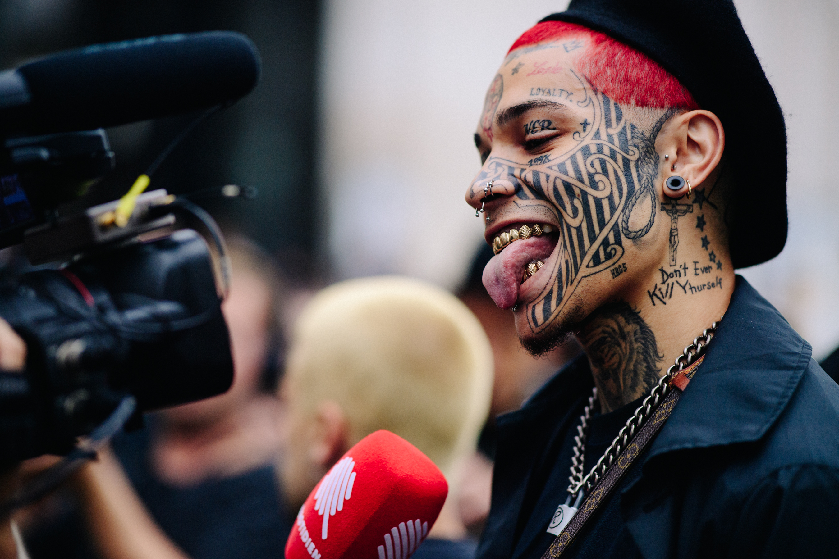 Heavily tattooed man with red hair