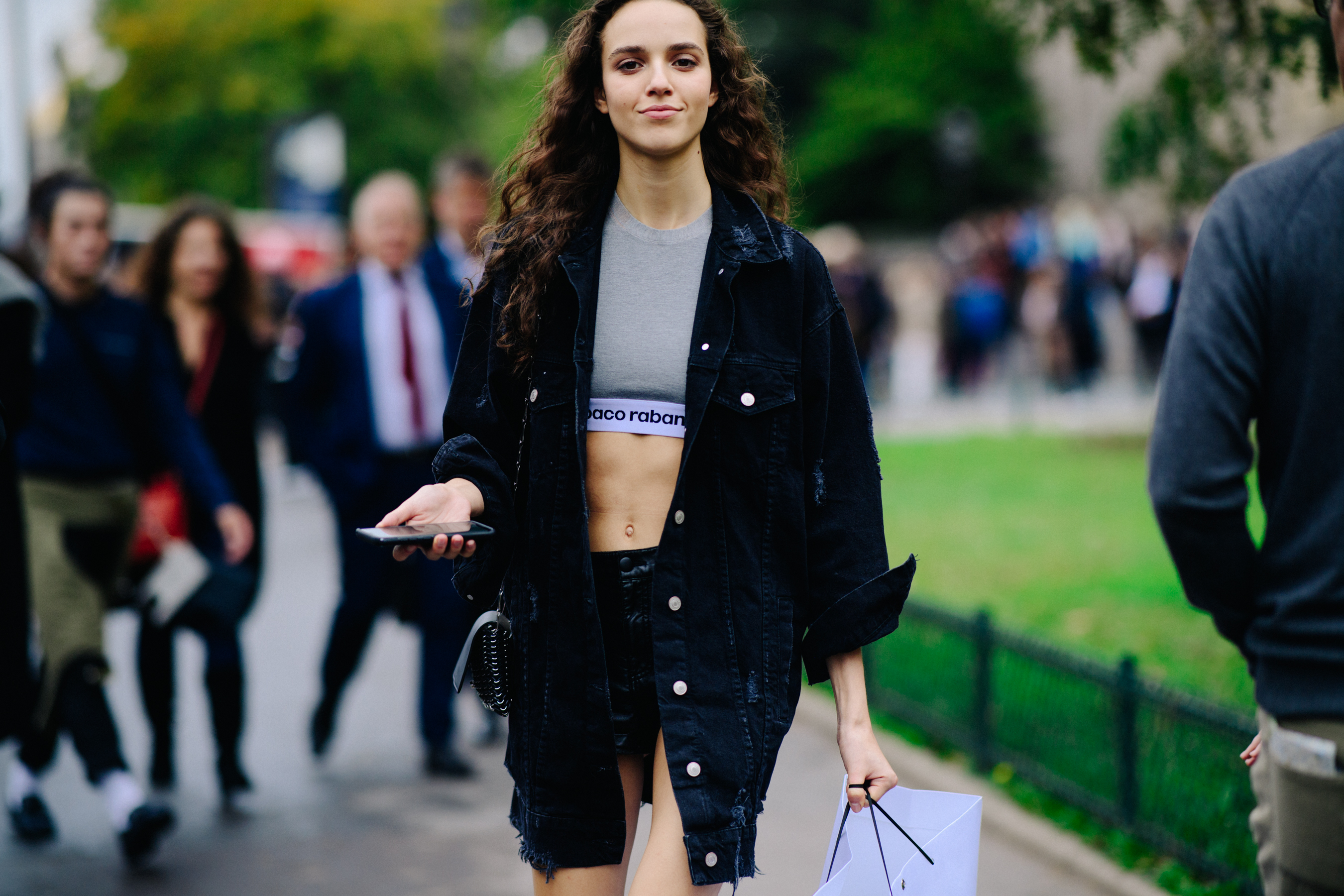 Model wearing black denim jacket