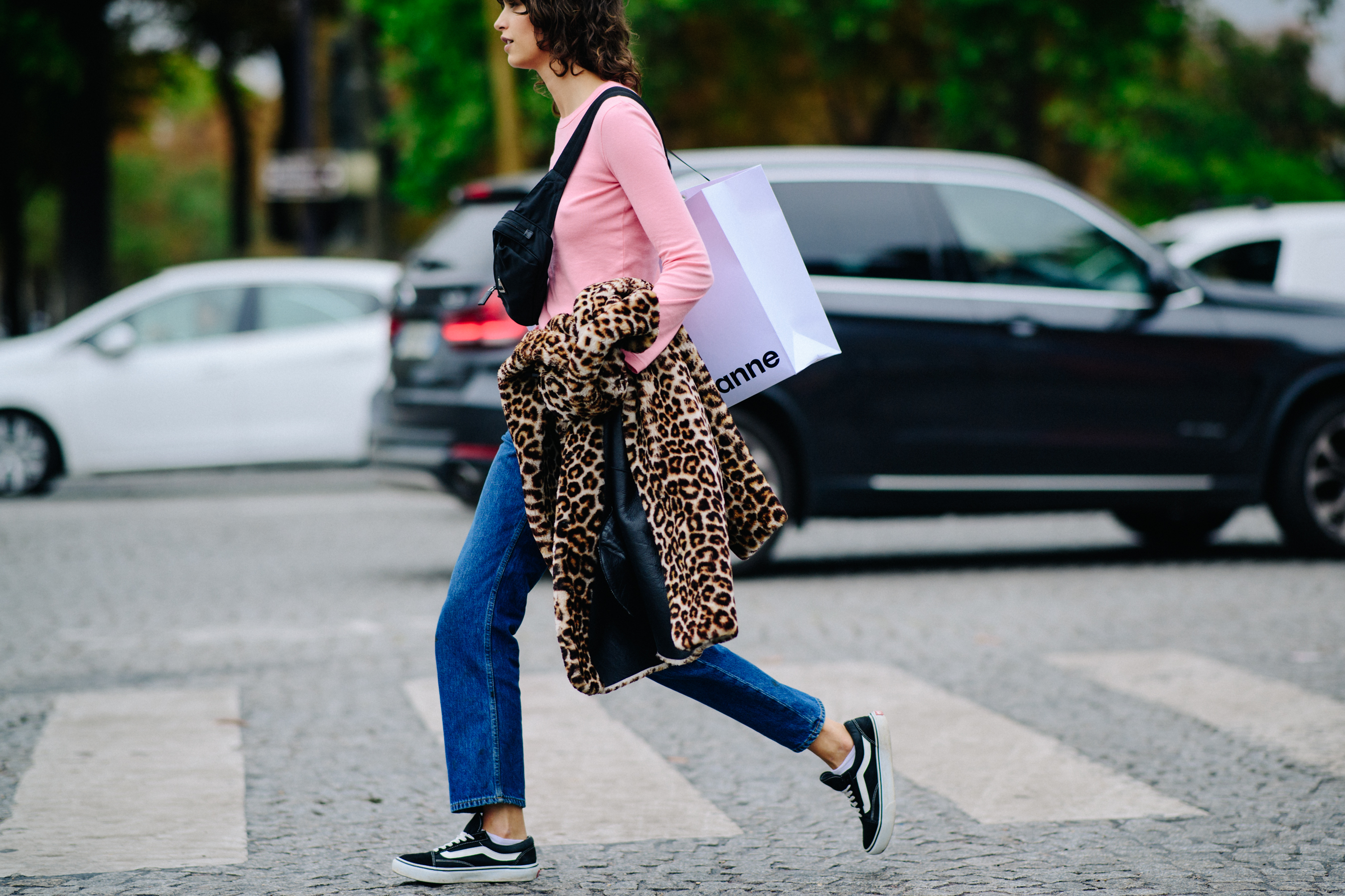 Model wearing pink lognsleeve after a show