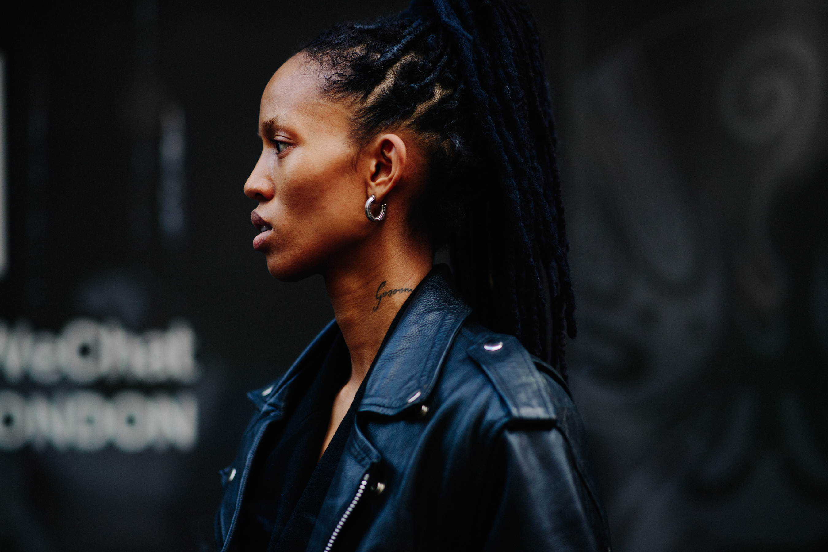 Model wearing black denim jacket