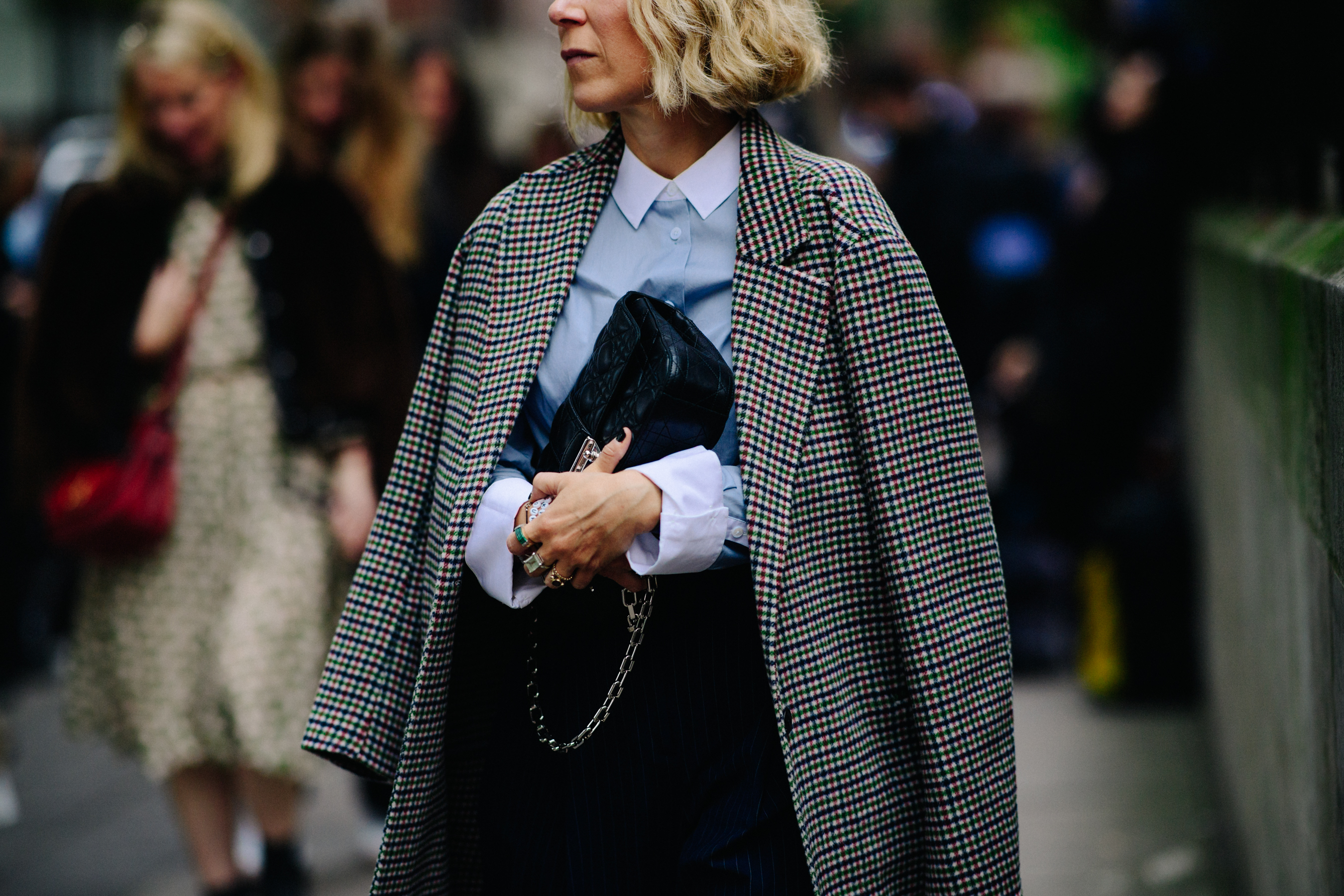 Woman wearing coat and Chanel bag