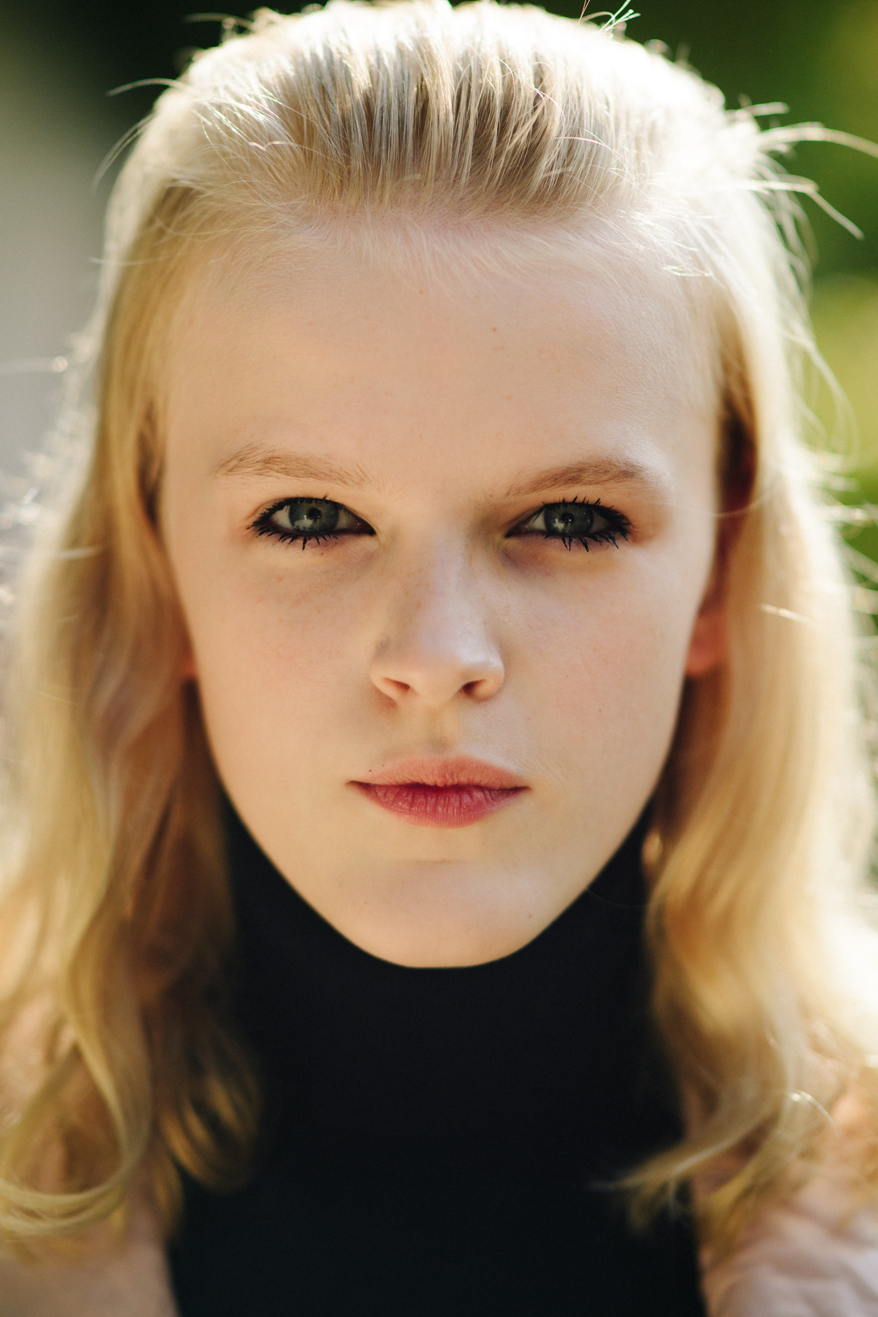 Portrait of a blonde model after a show