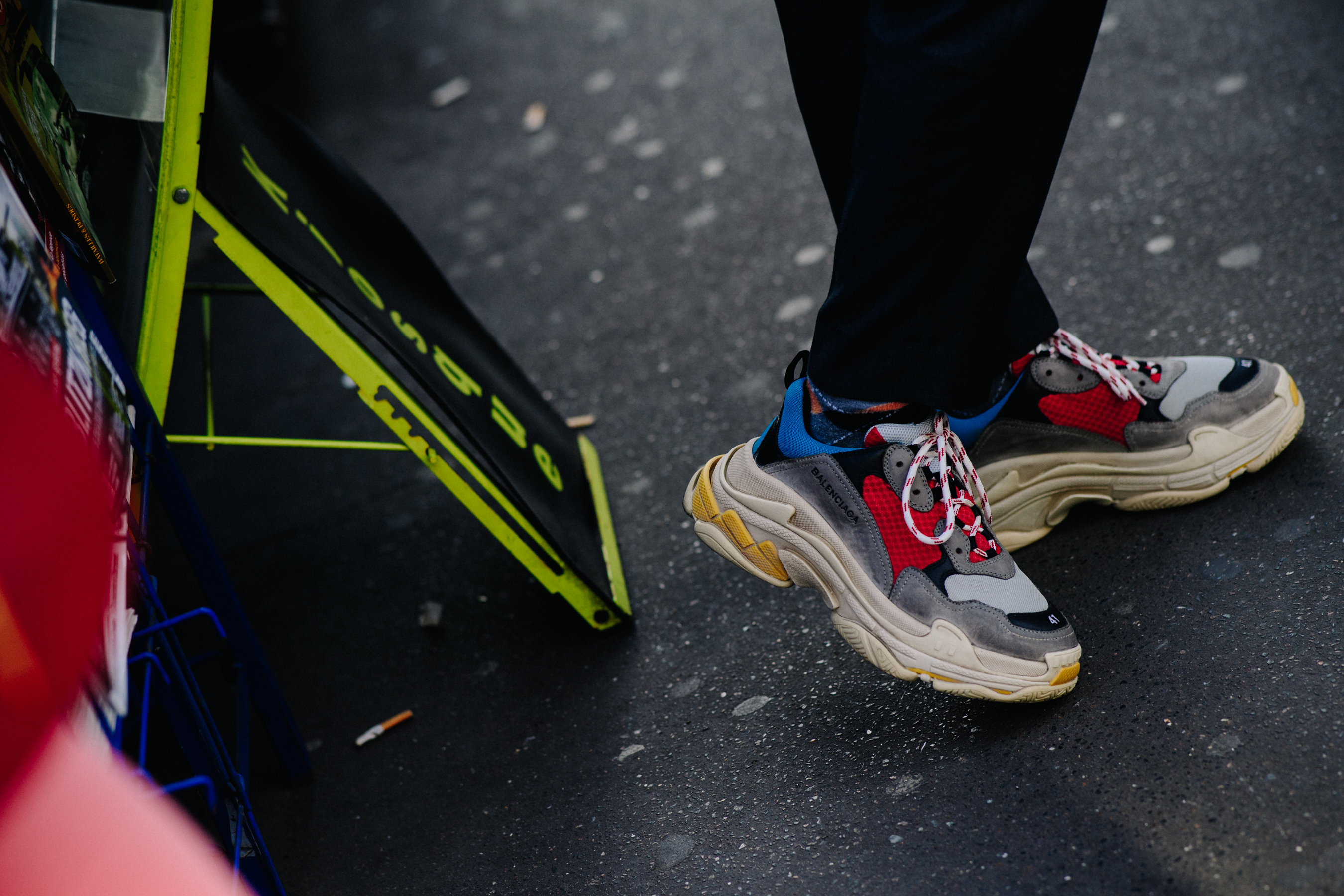 Person wearing Balenciaga Triple S sneakers