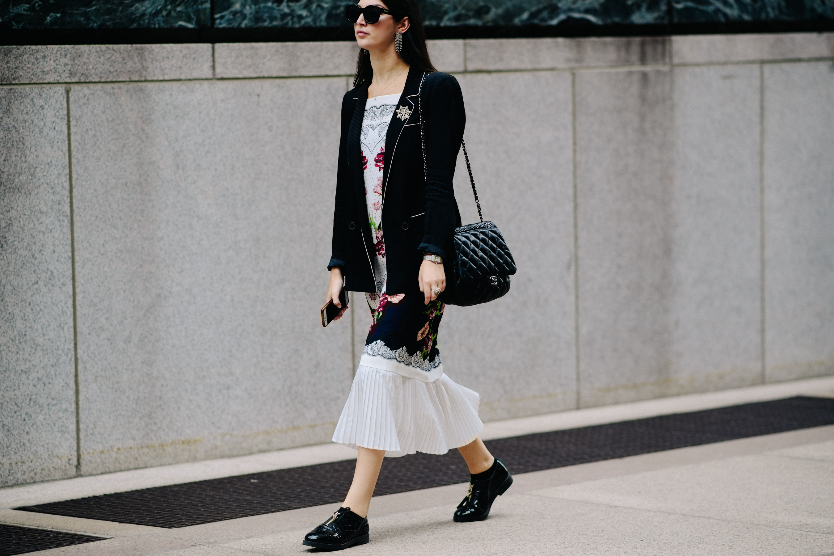 Woman wearing black Chanel handbag