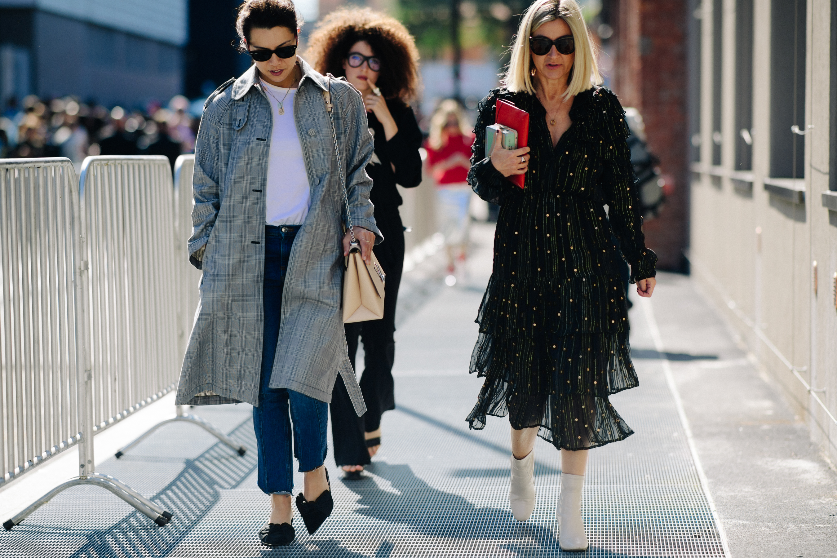 Three women walking after Gucci show