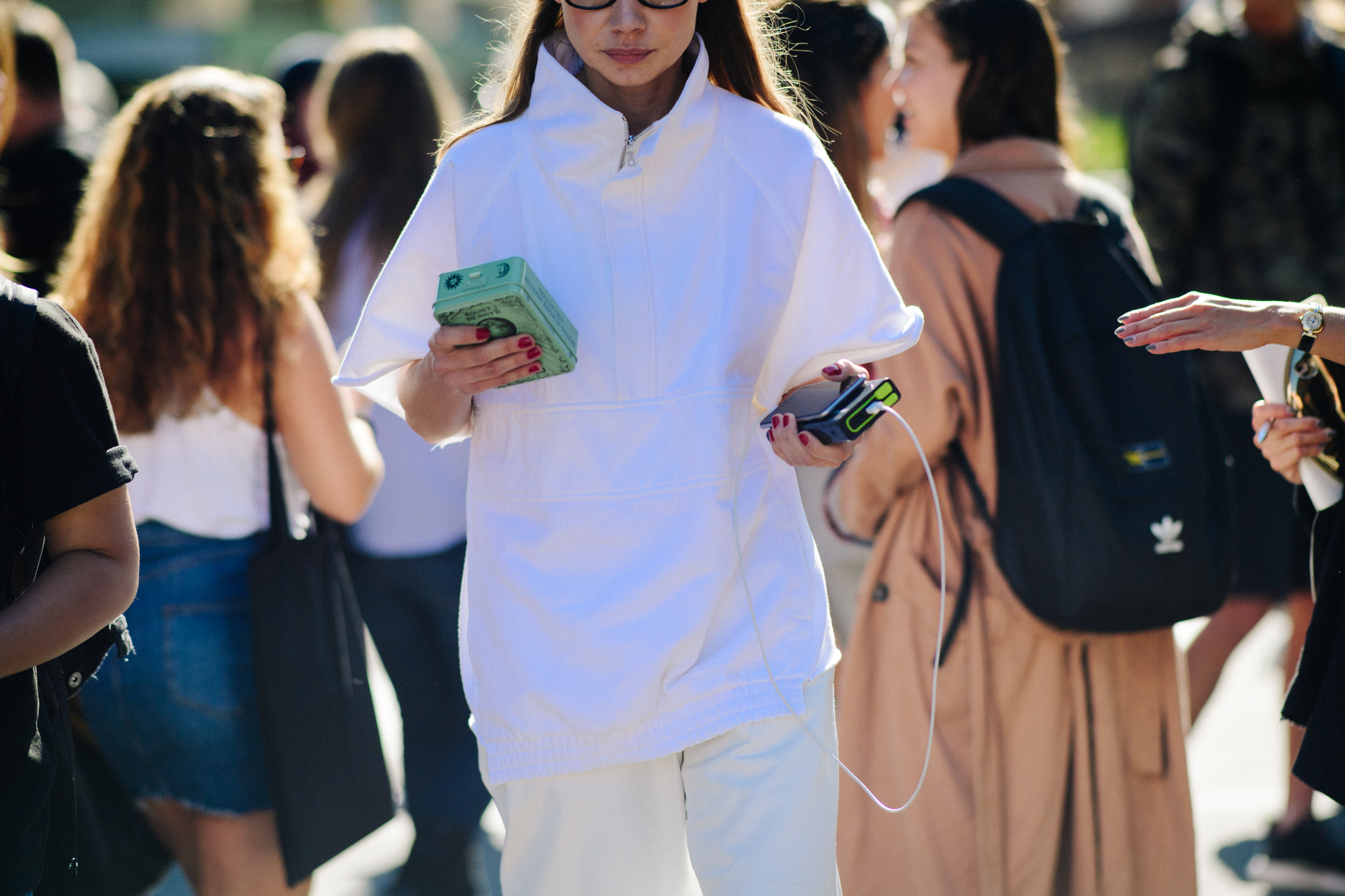 Woman wearing white high collar shirt