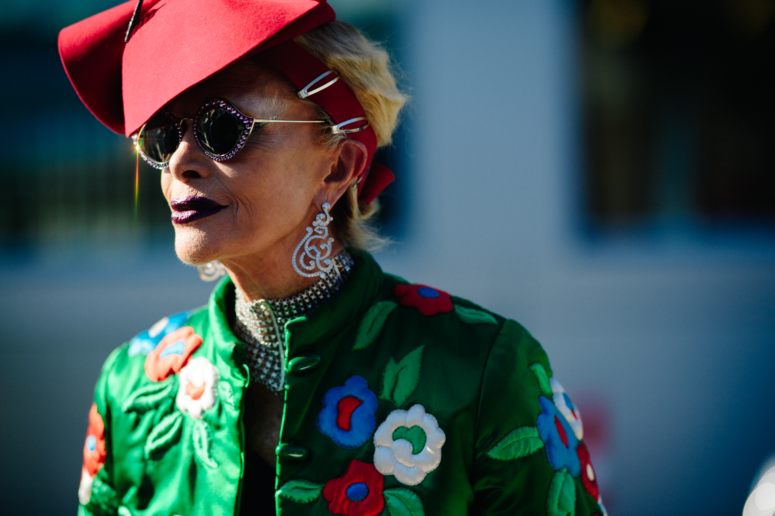 Closeup of woman in red hat and sunglasses