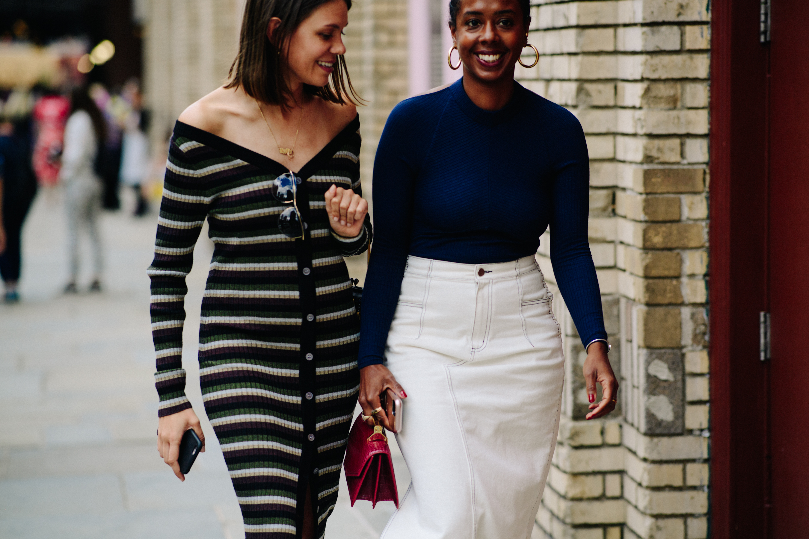 Two stylists wearing knitwear