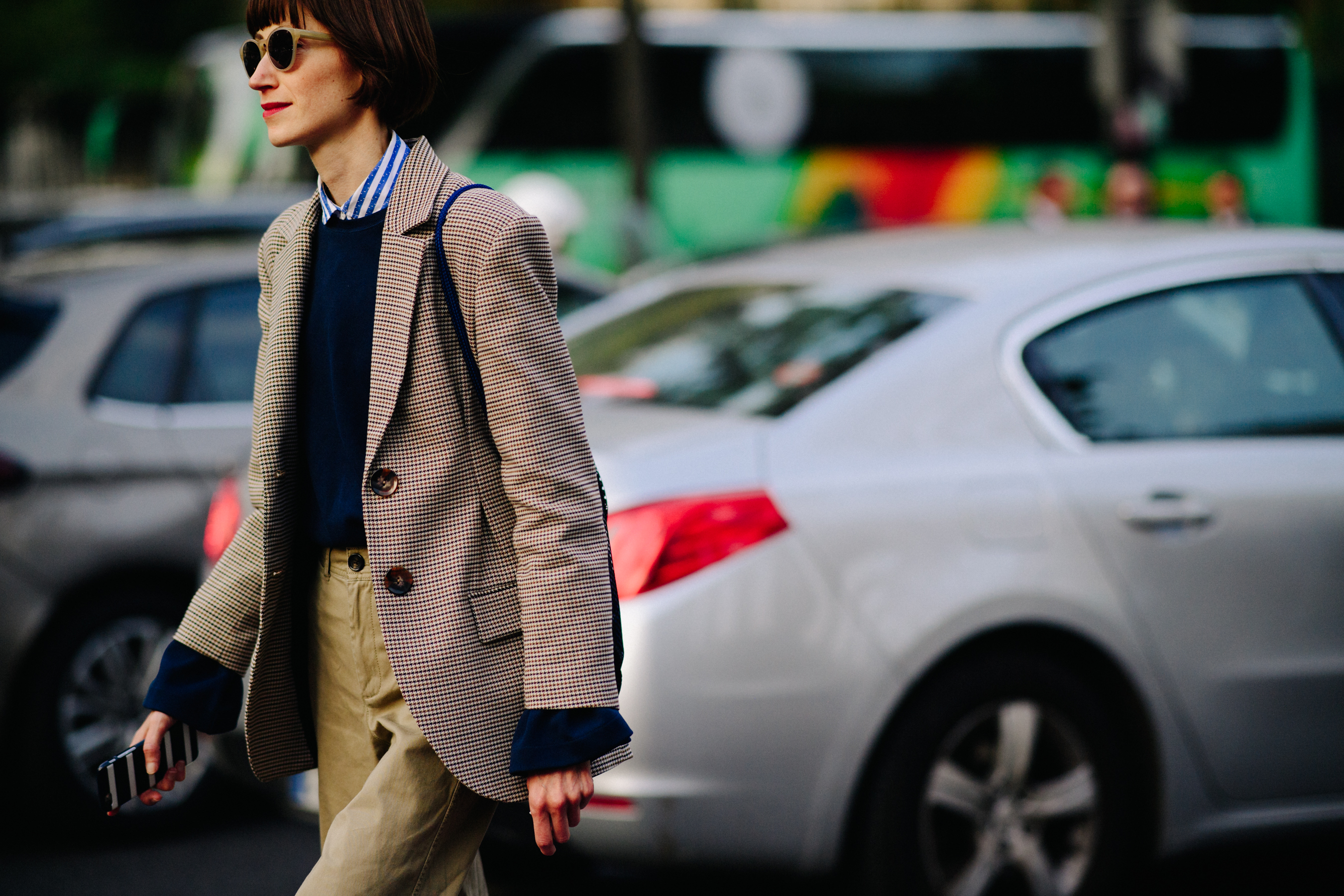 Woman wearing suit and glasses