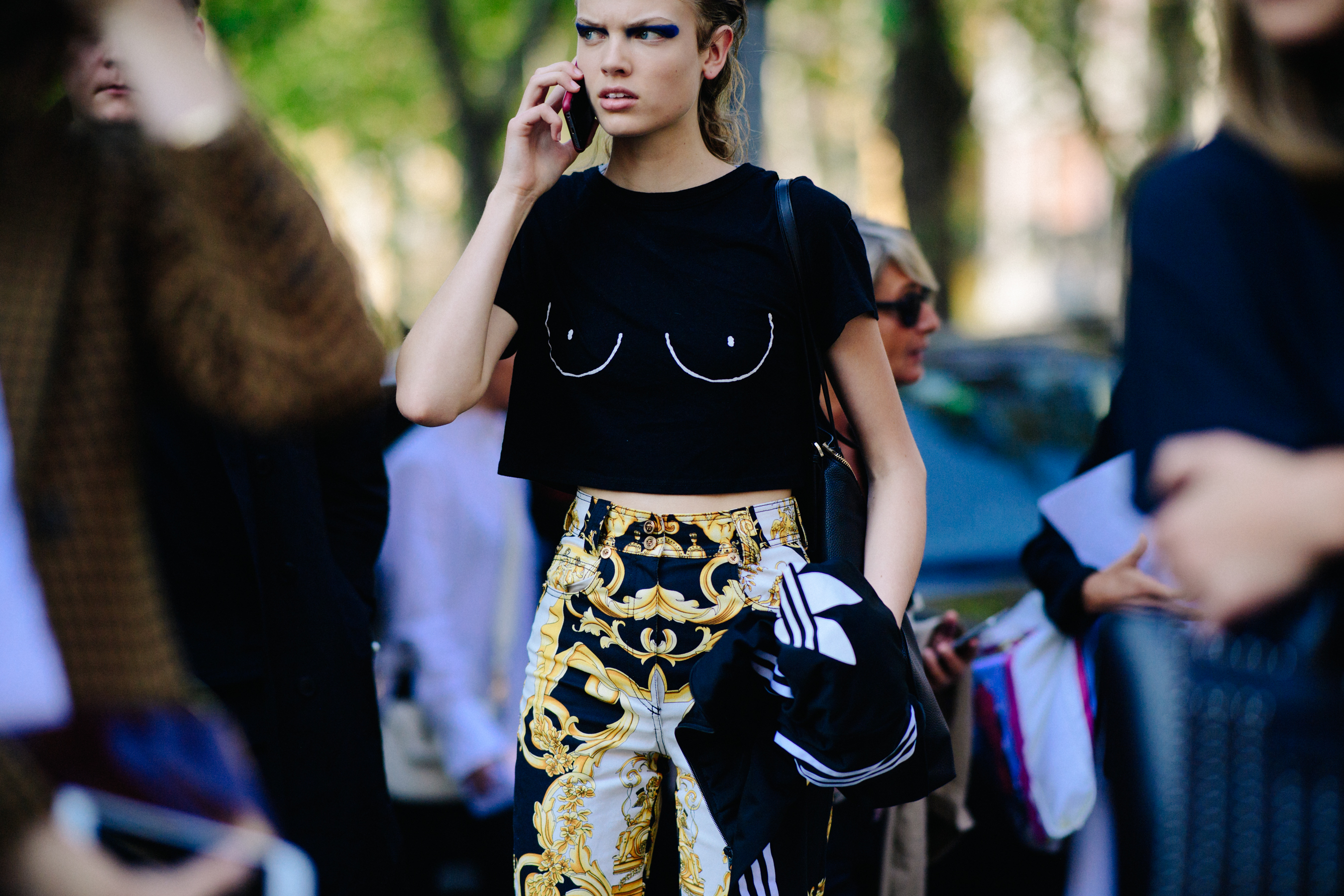 Model wearing yellow skirt and black t-shirt