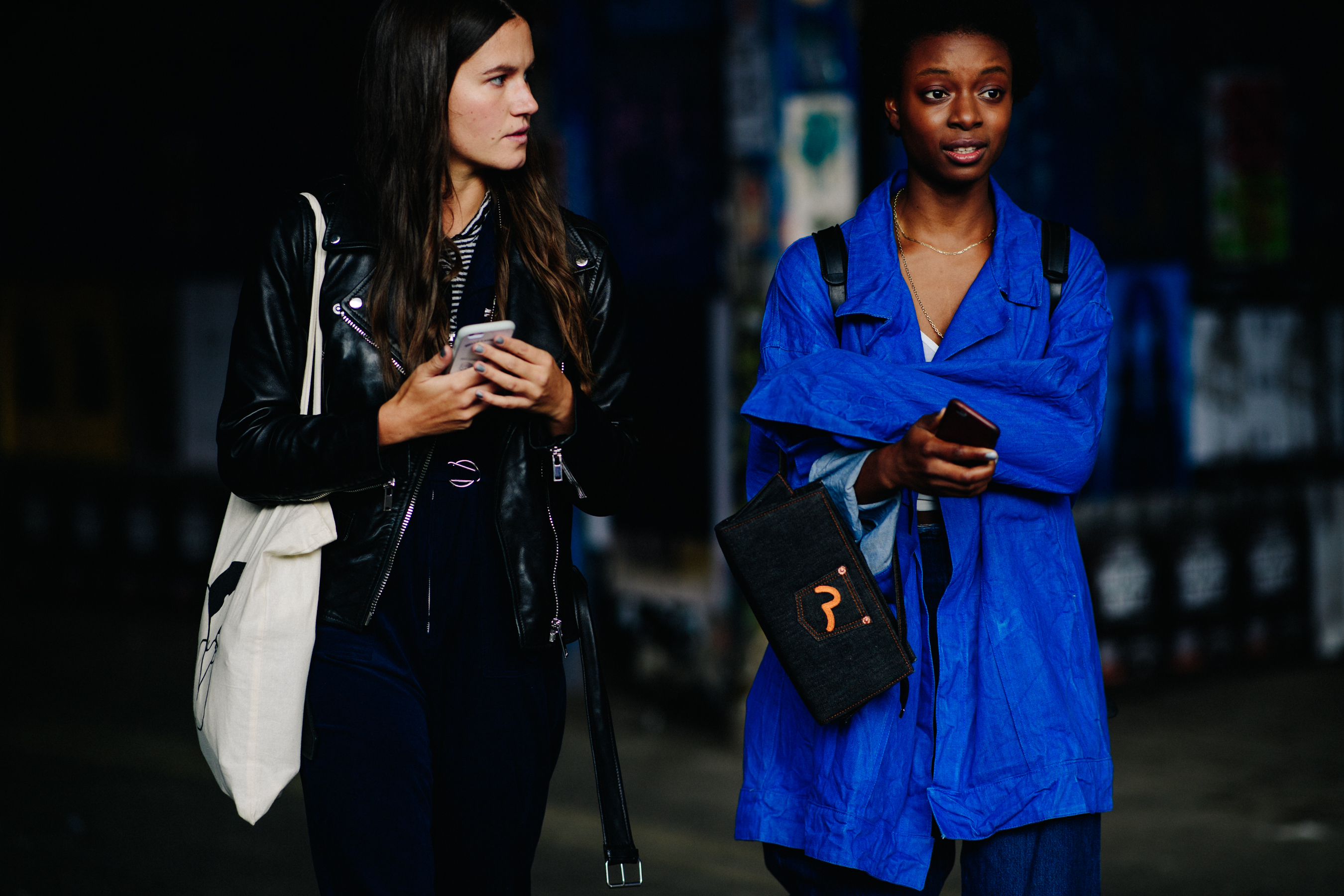 Two models wearing blue and black