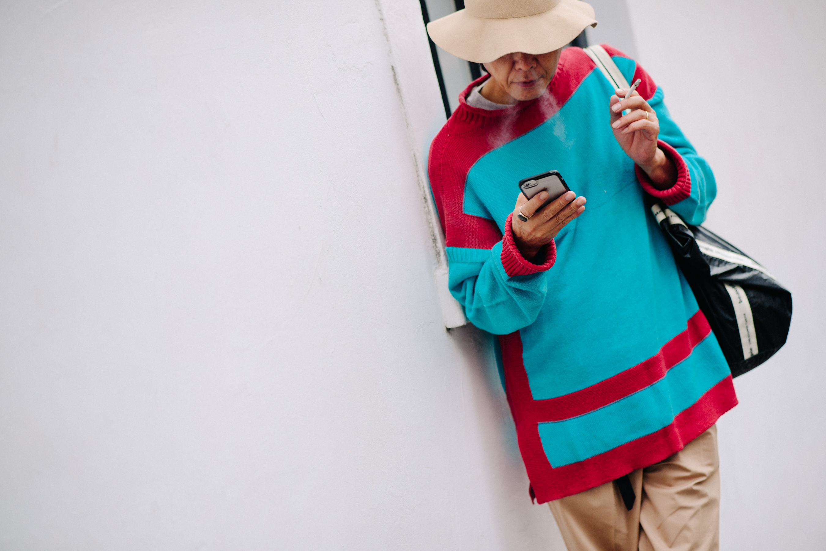 Man wearing hat and a blue sweater
