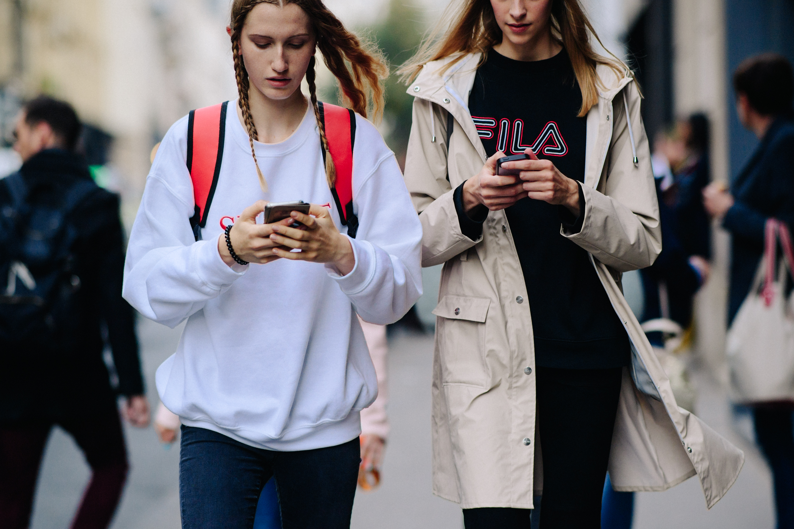 Two models with braided hair after a show