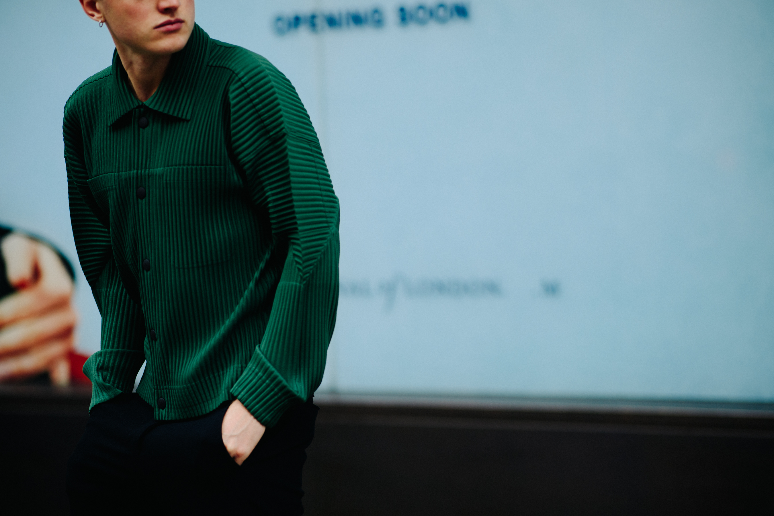 Man wearing green pleated jacket