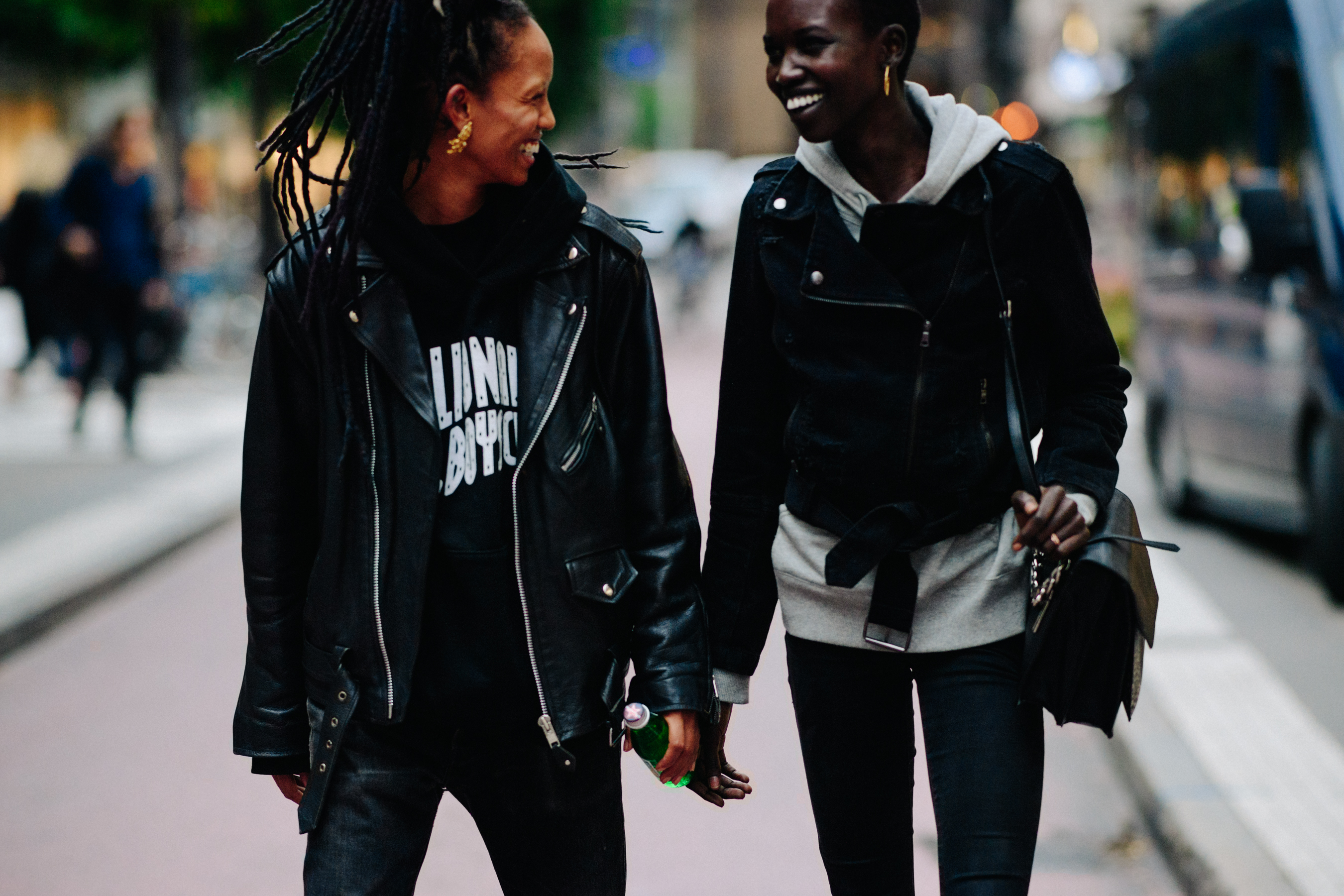 Two models wearing leather jackets