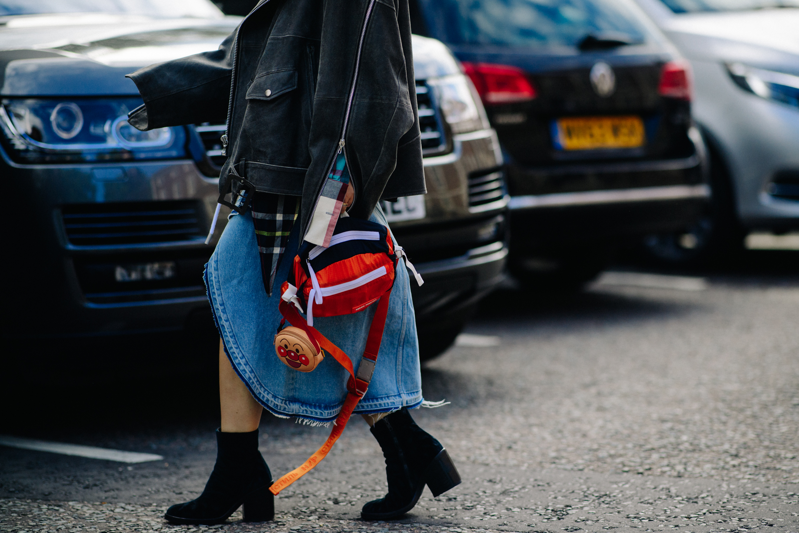 Woman wearing red bag and boots