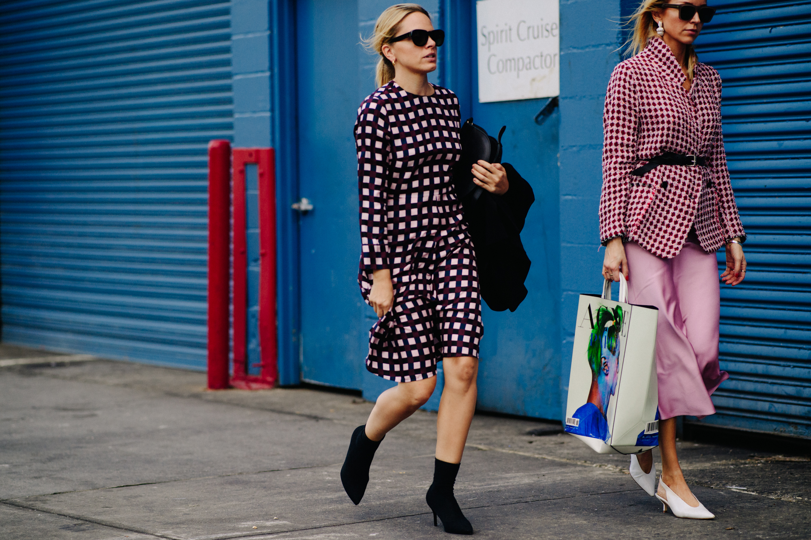 Two women wearing printed outfits