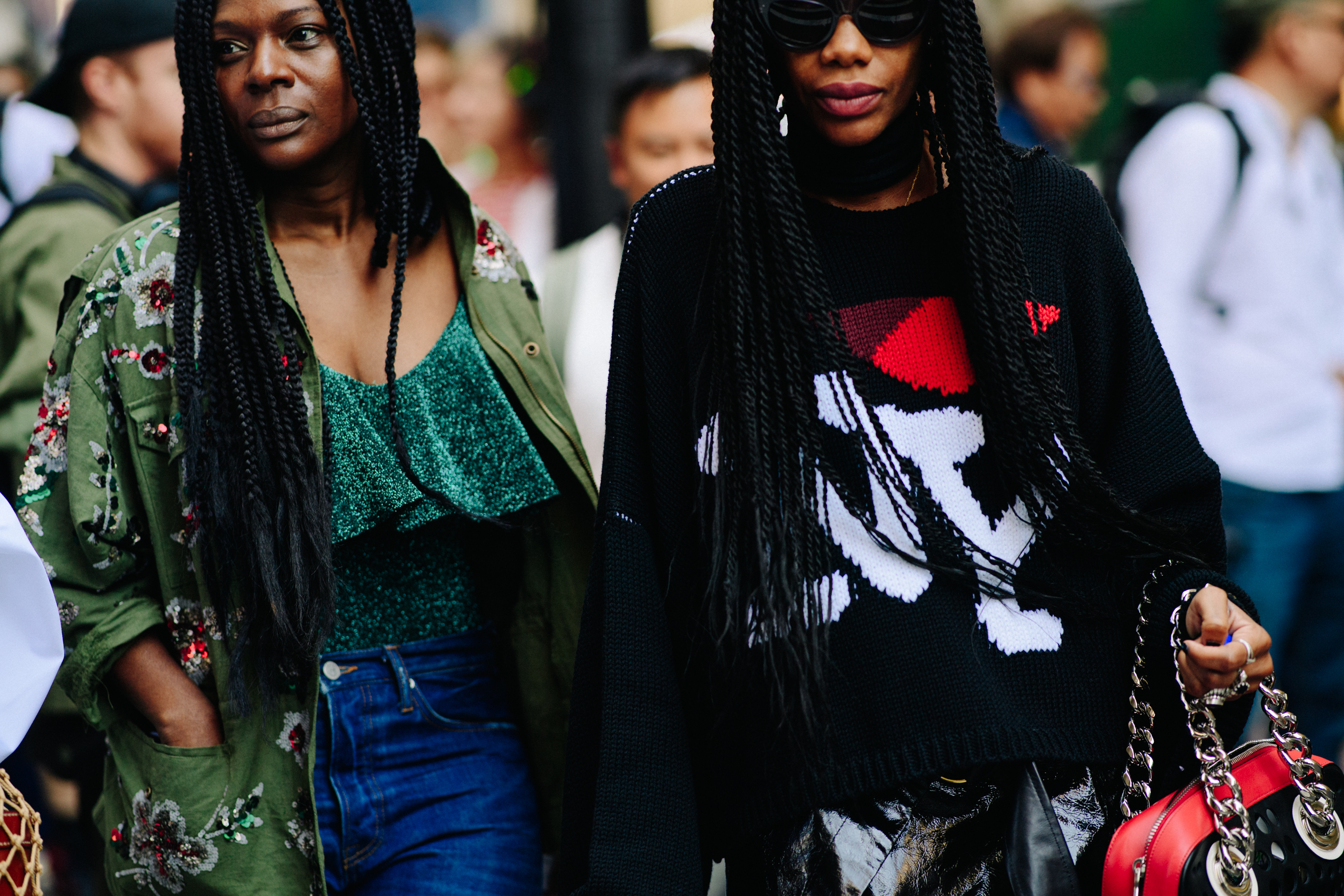 Two women wearing colourful shoes