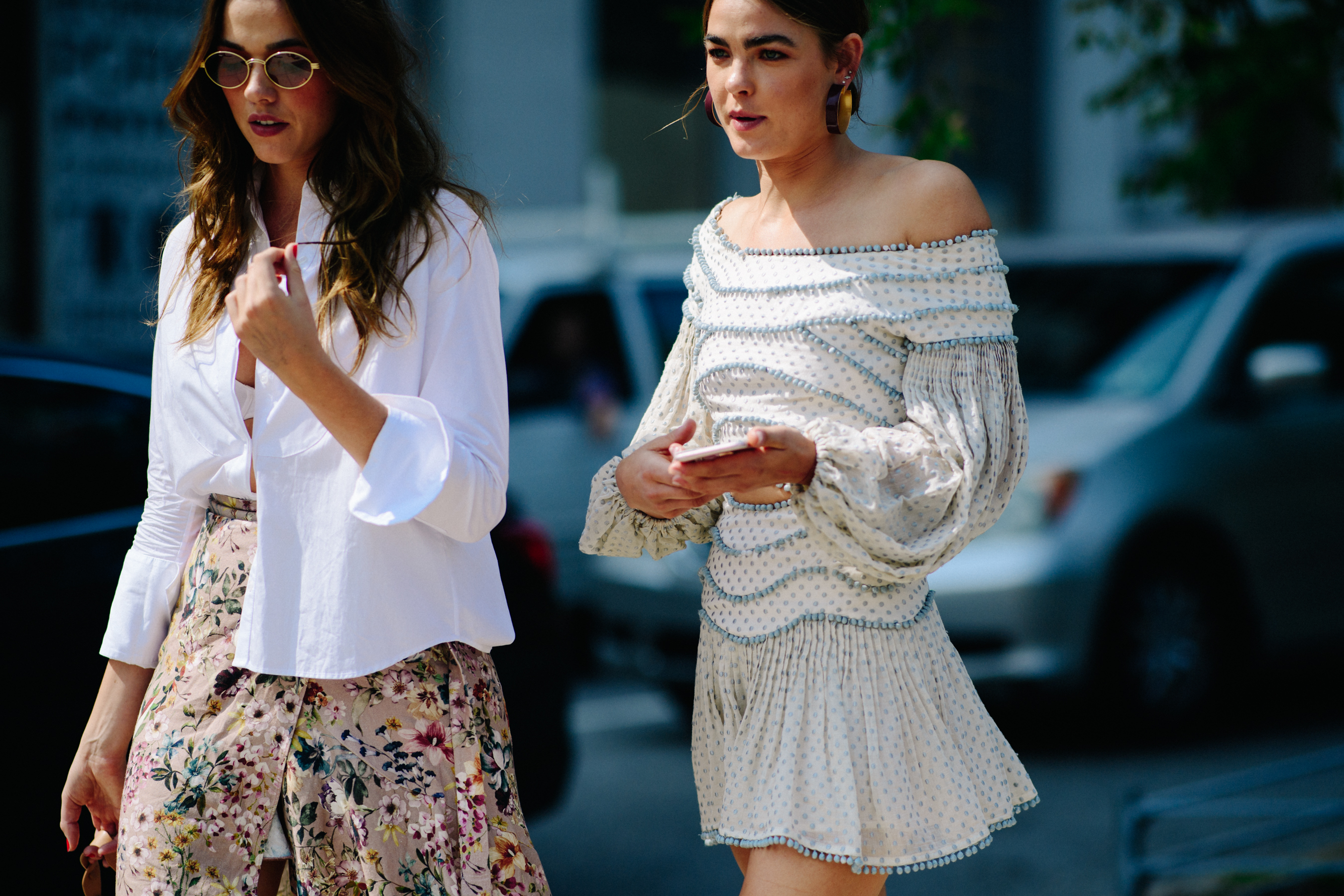 Two women wearing white clothes