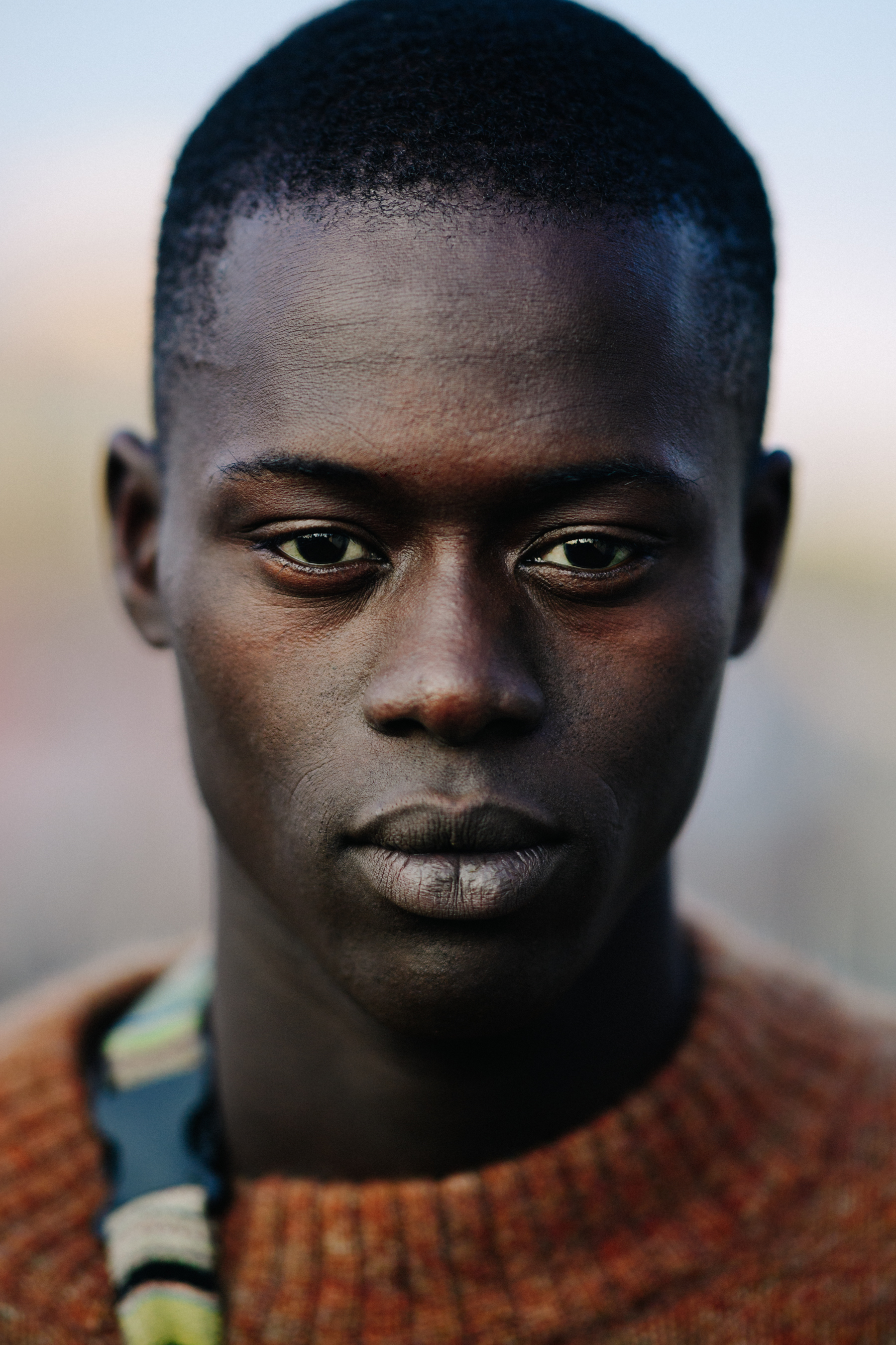Portrait of black male model with shaved head