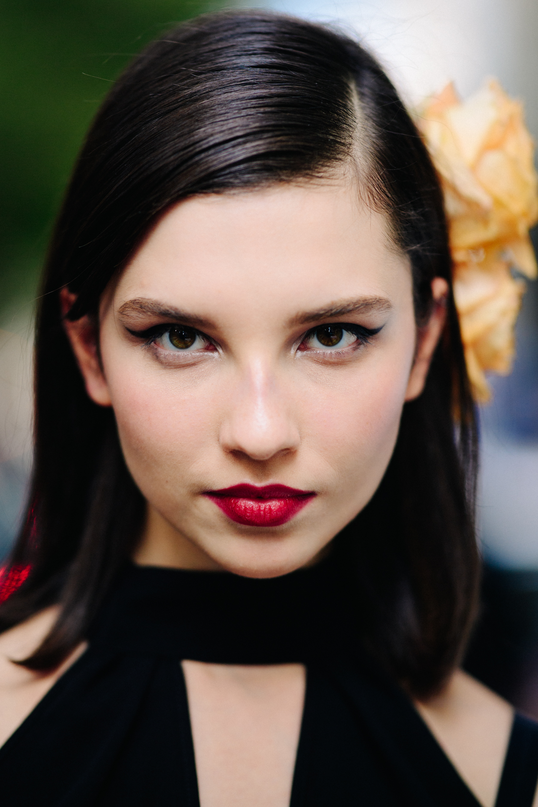 Portrait of a model with red lips after the show