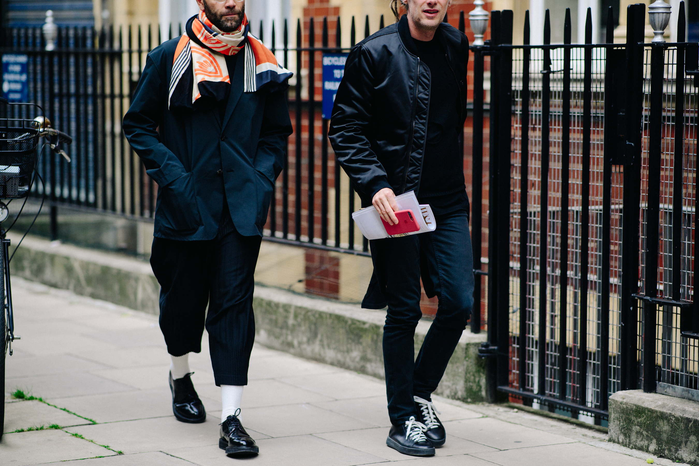 Two journalists wearing all black