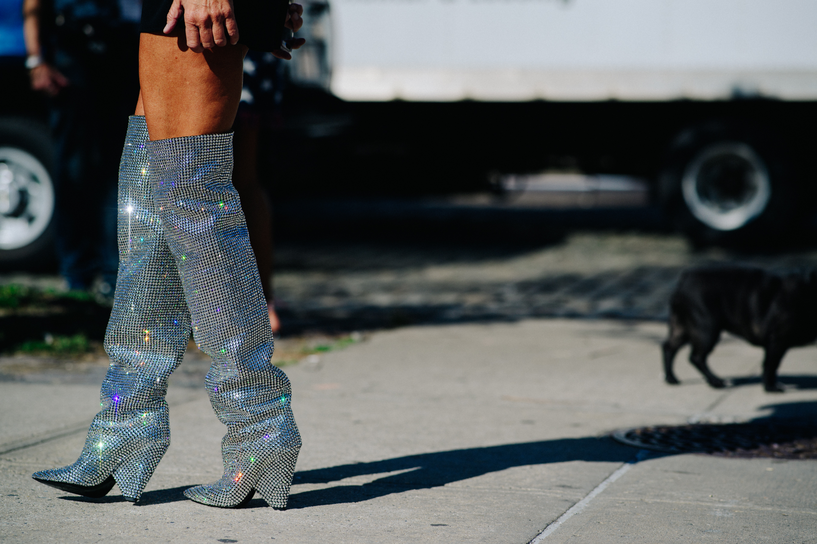 Italian stylist wearing Saint Laurent shiny boots