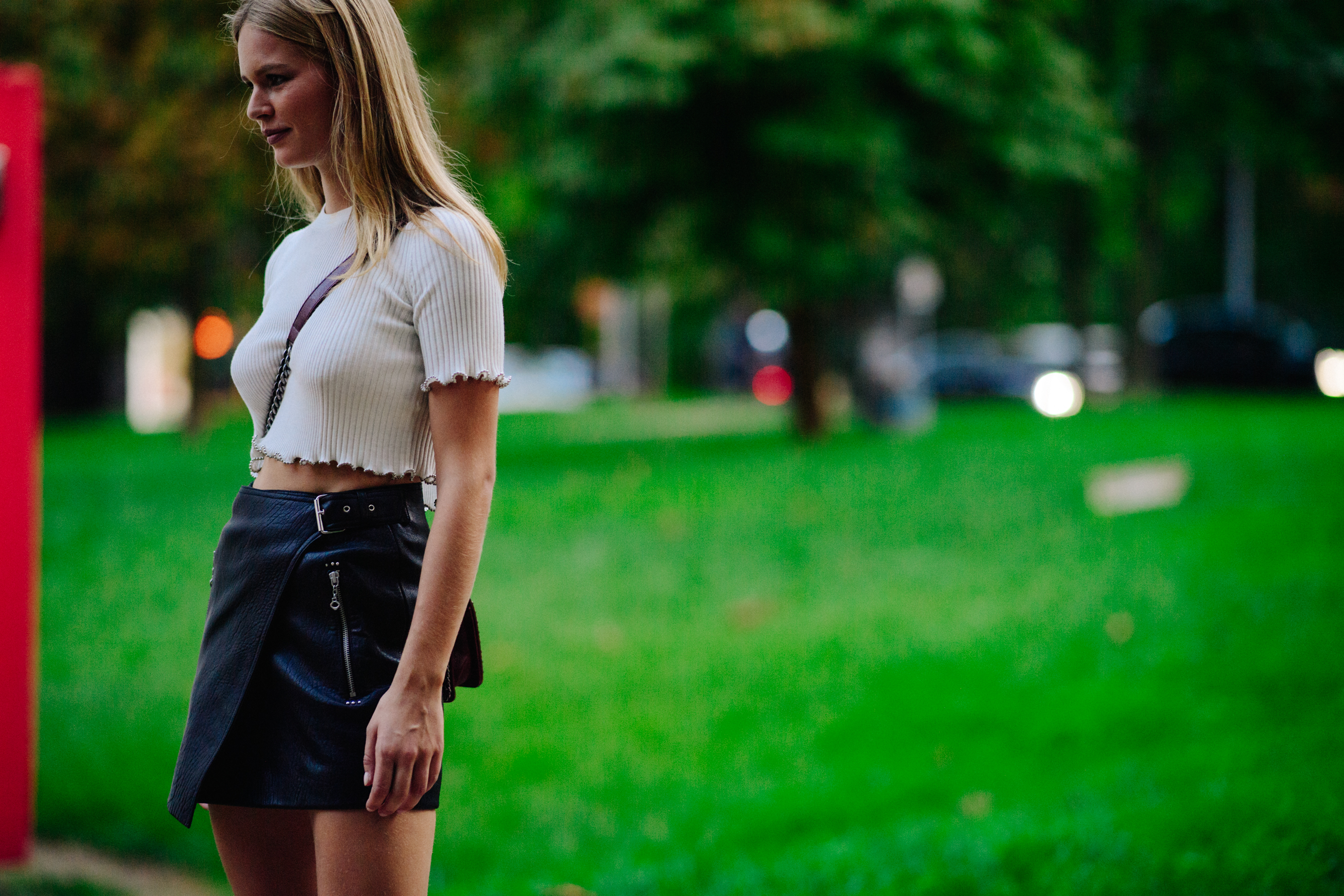 Blonde model wearing short top and skirt