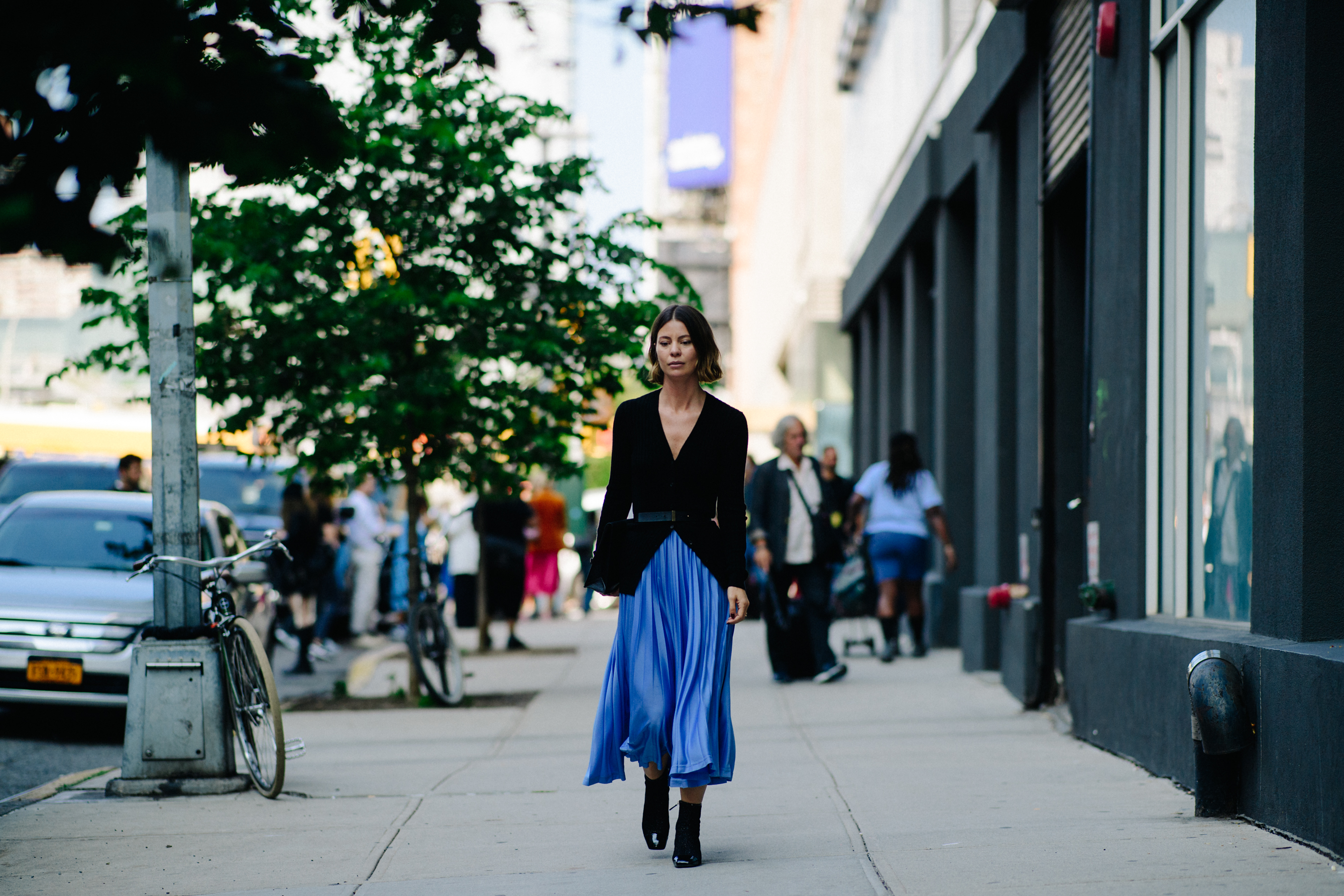 Stylist wearing blue skirt