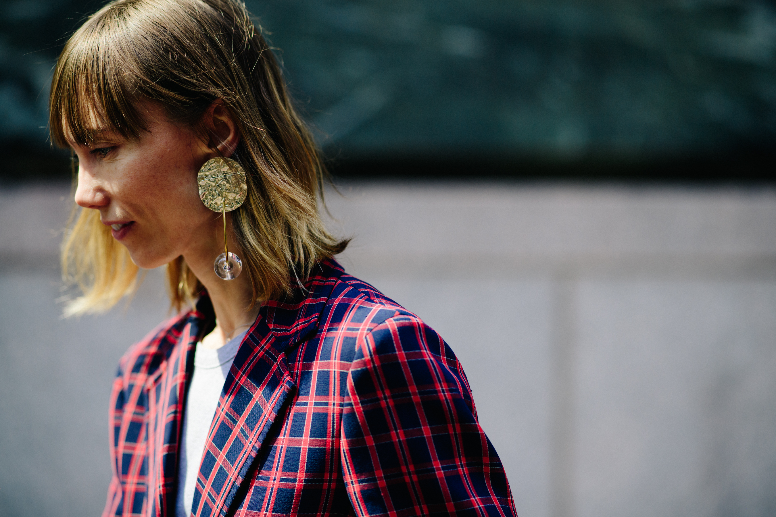 Russian stylist wearing golden earrings