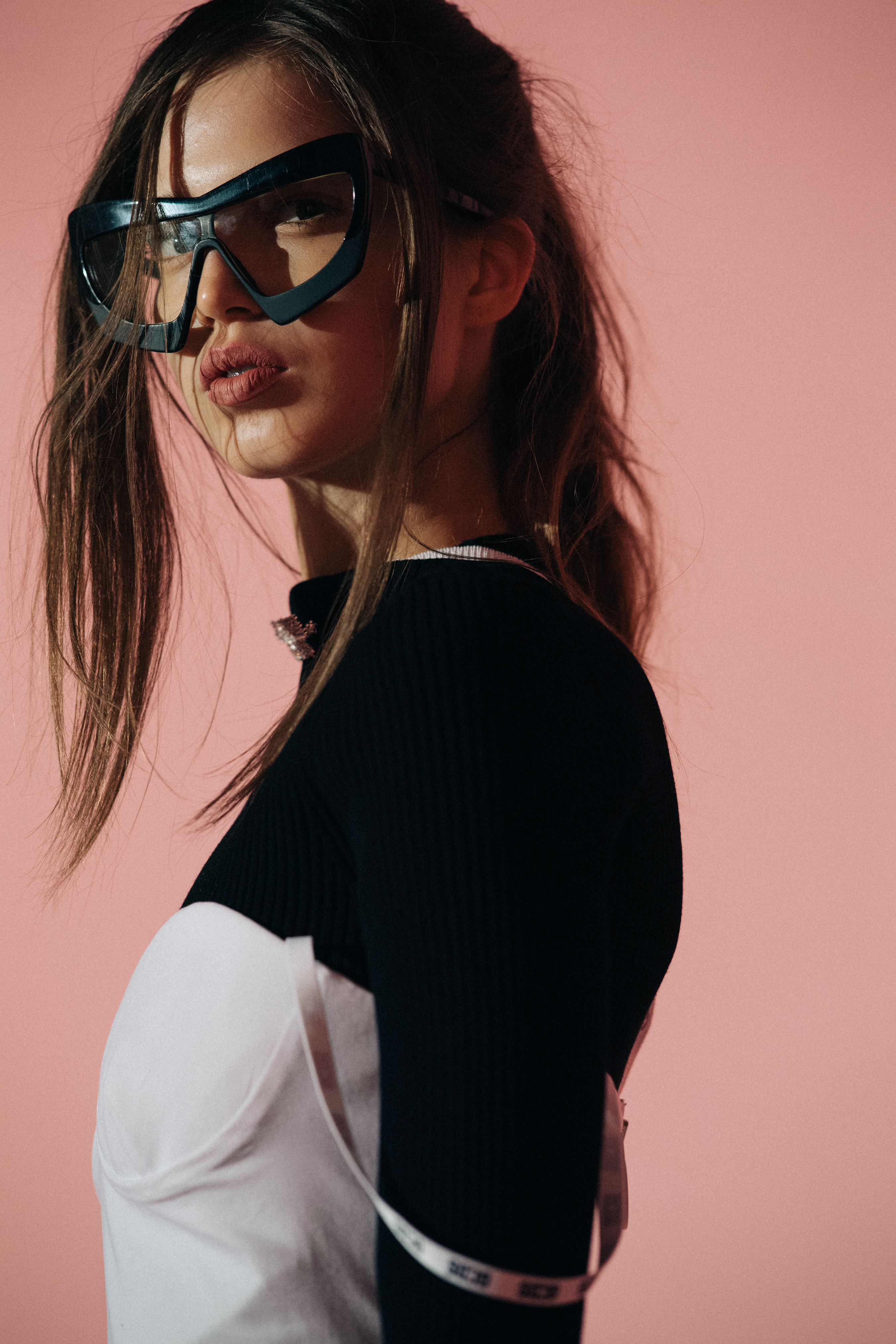 Model wearing white dress over longsleeve