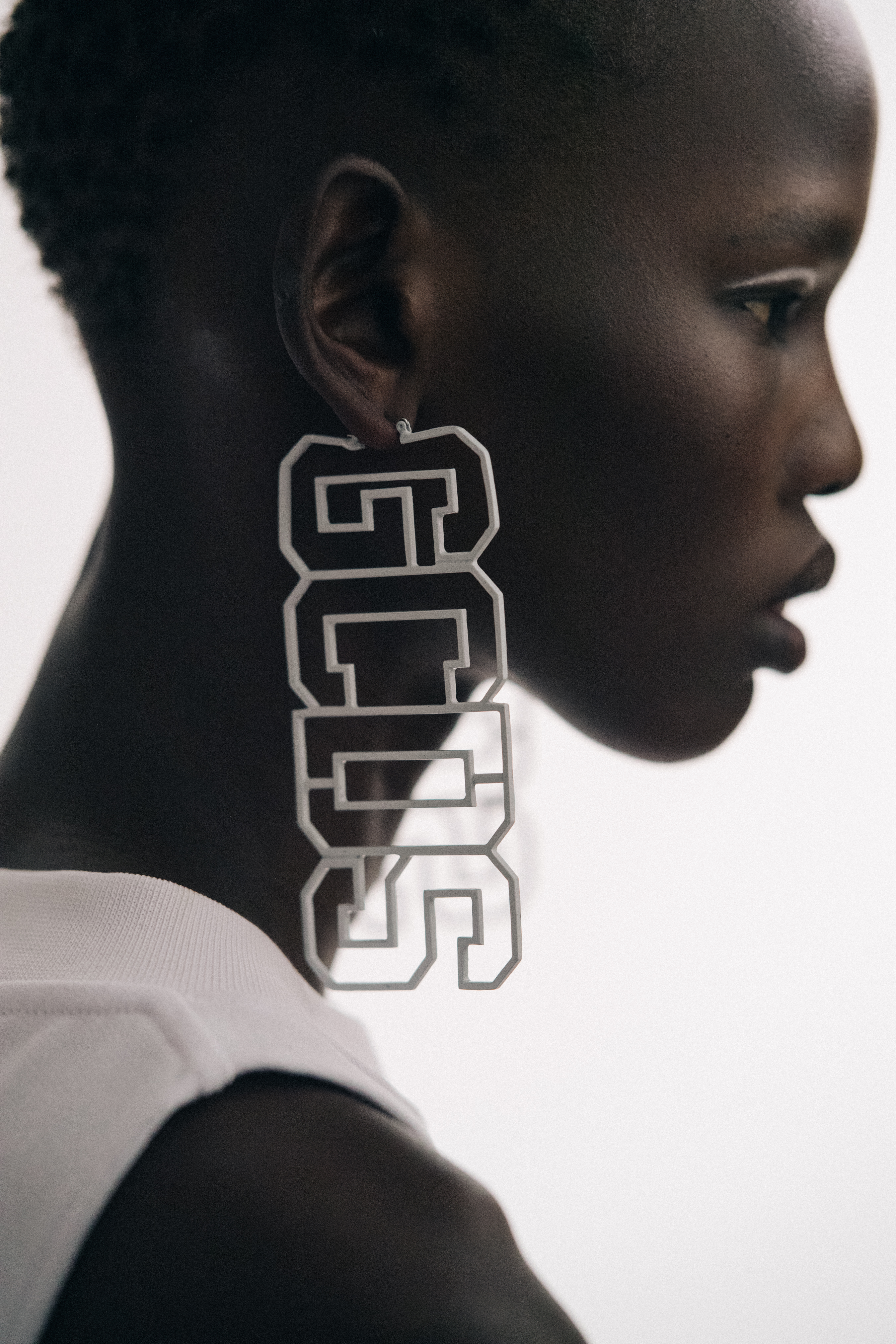 Model wearing big mongram earring
