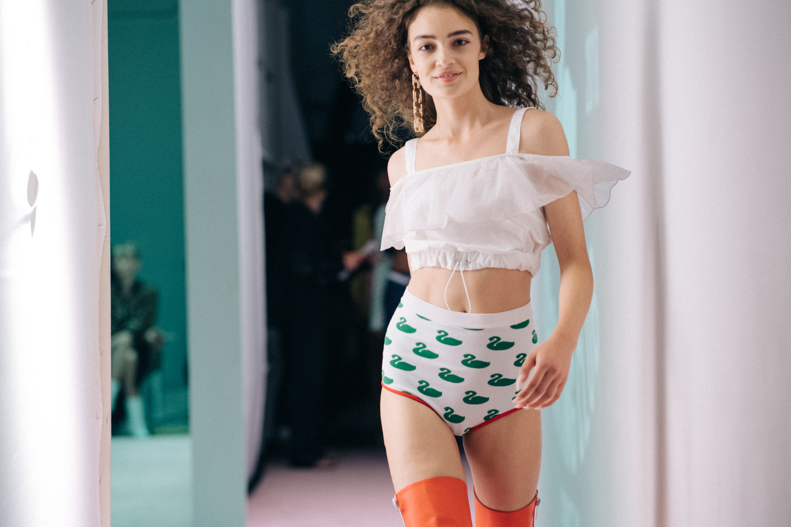 Model wearing white outfit