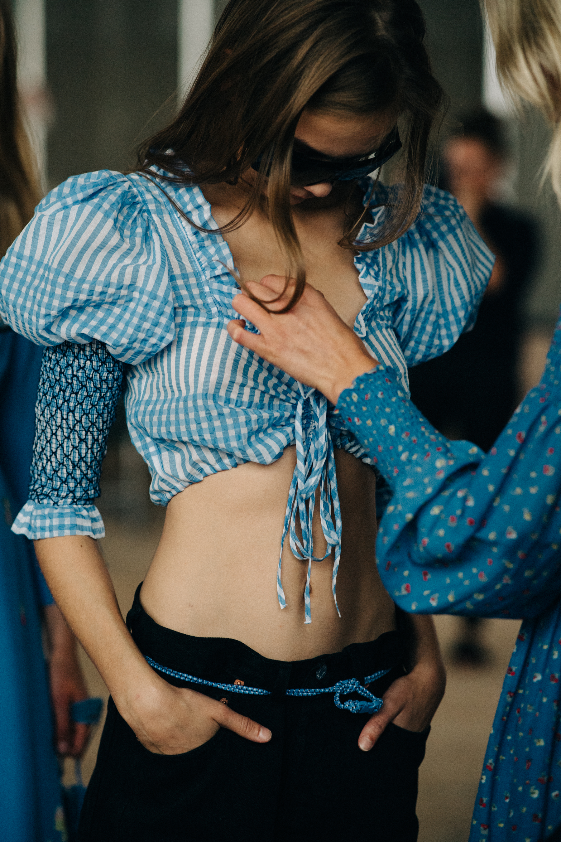 Model wearing blue top