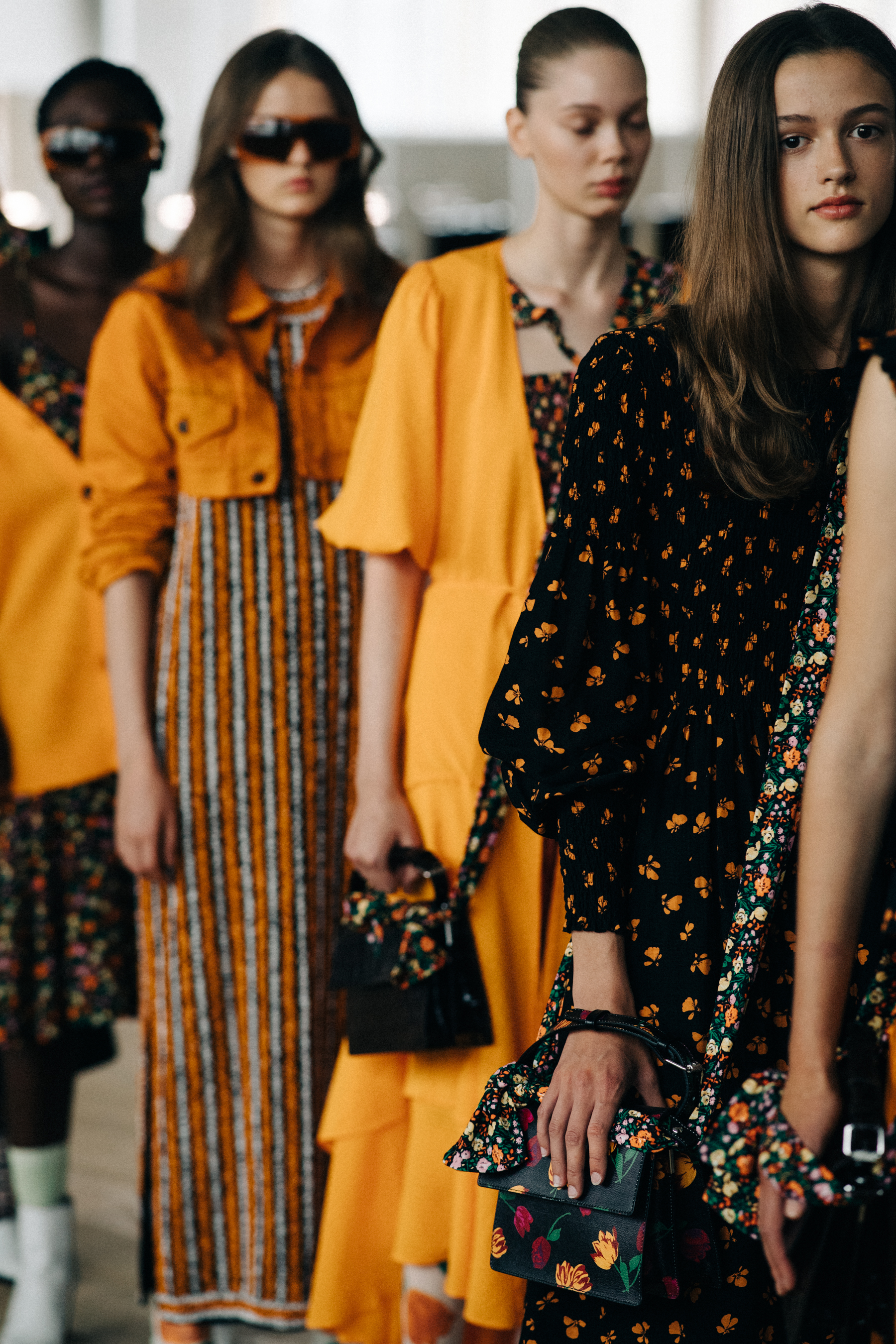 Group of models dressed before a show