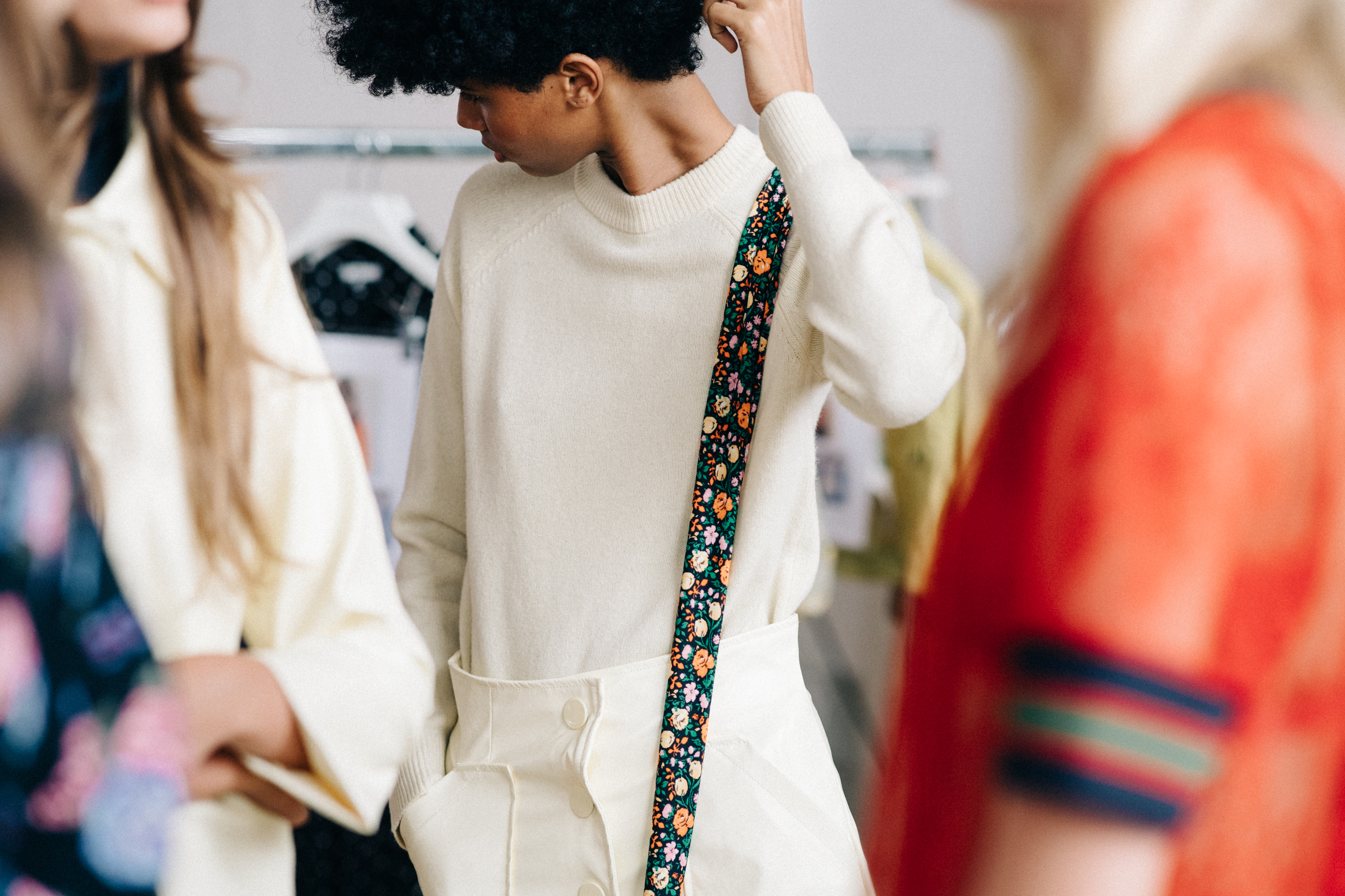 Model wearing white before a show