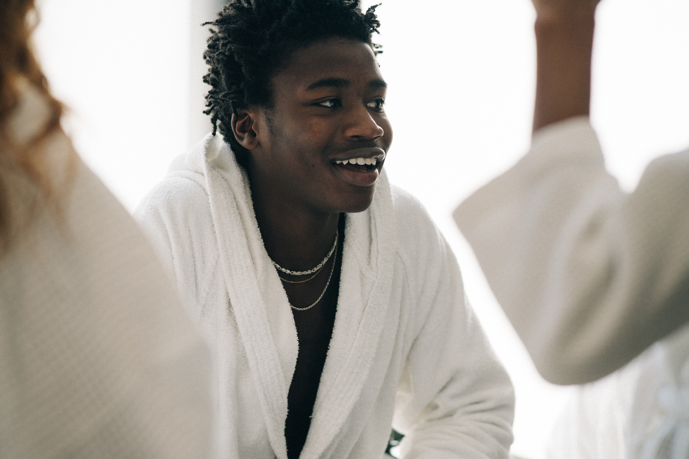 Model backstage in dressing robe