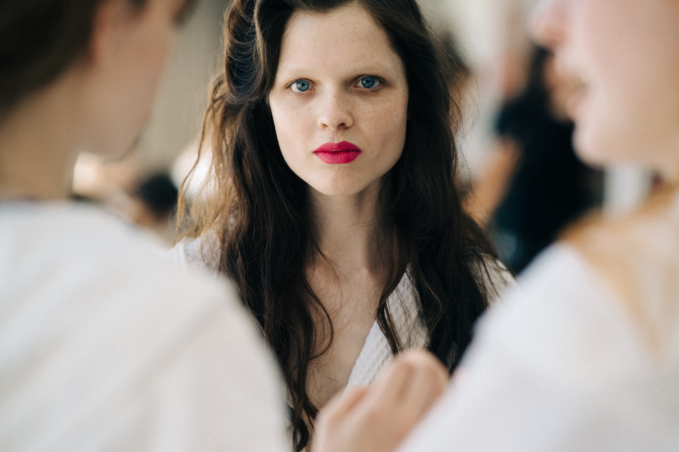 Model backstage with red lips