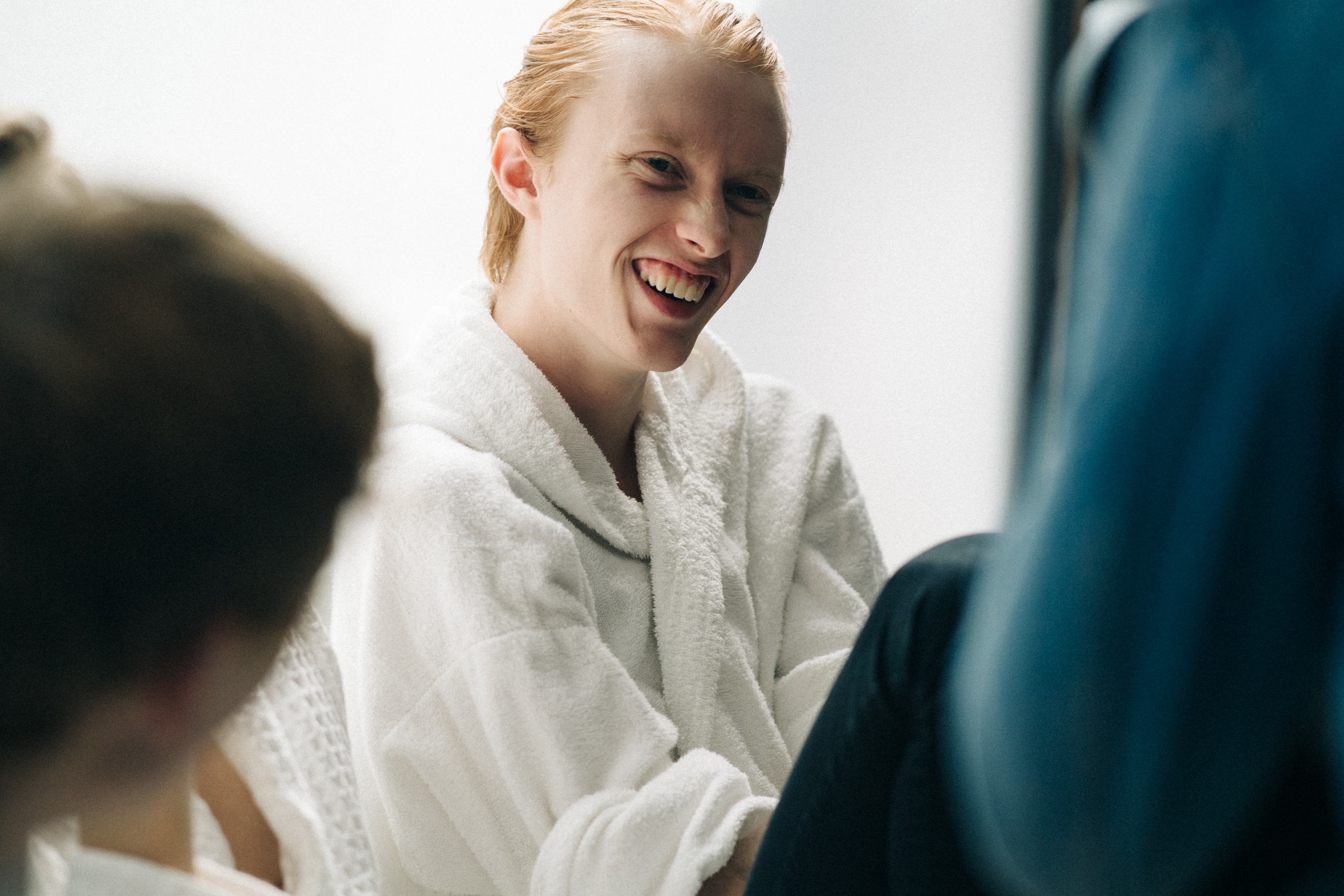 Model laughing backstage