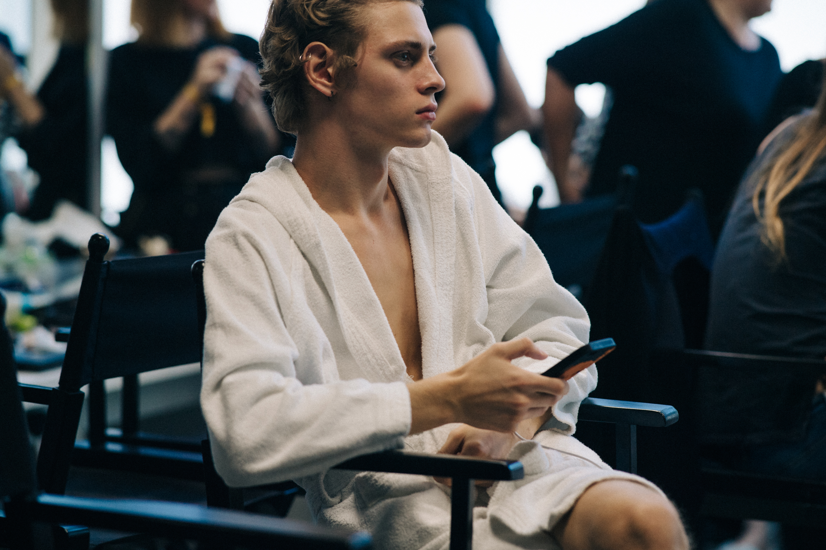 Model backstage on phone