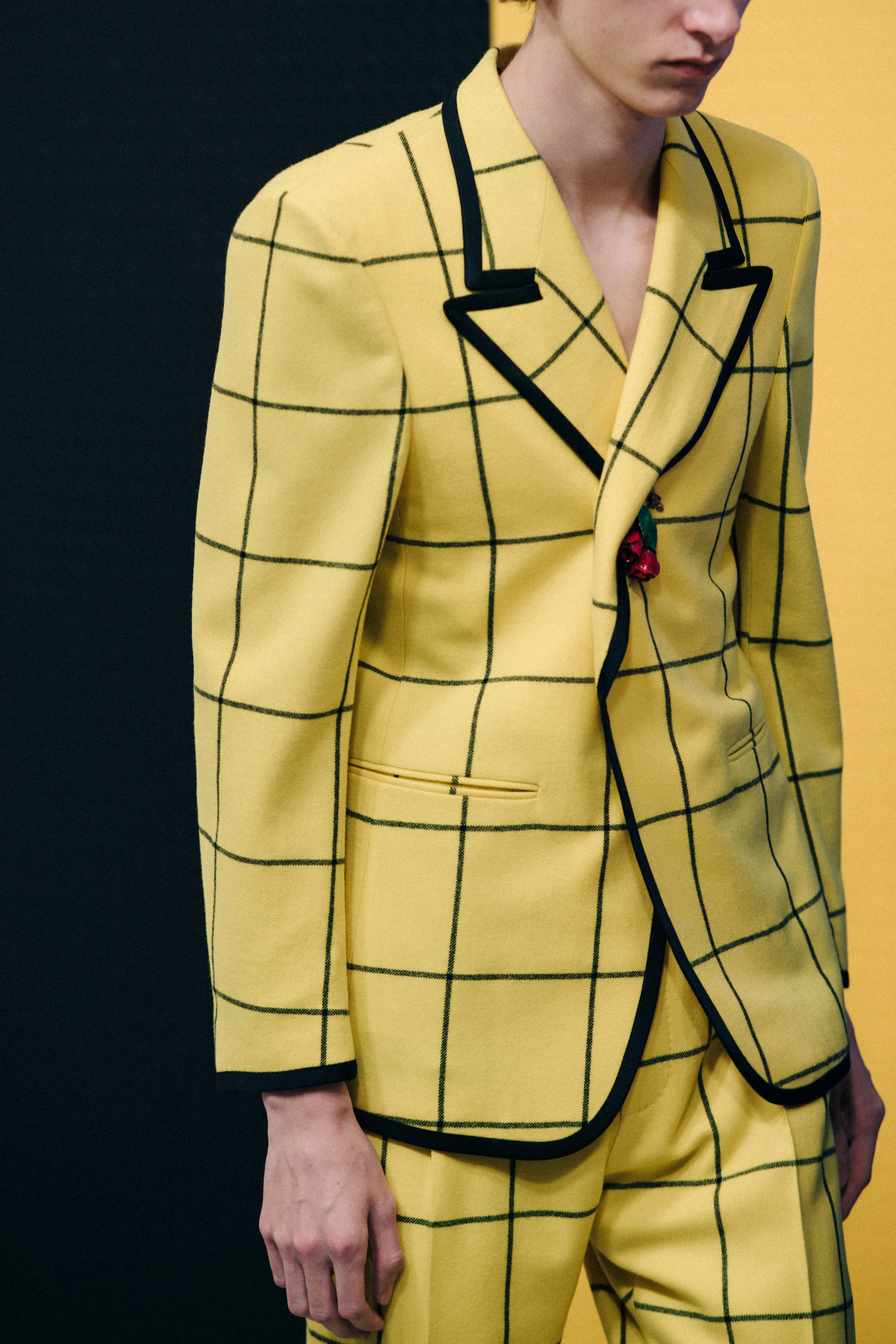 Model backstage at Gucci in yellow suit