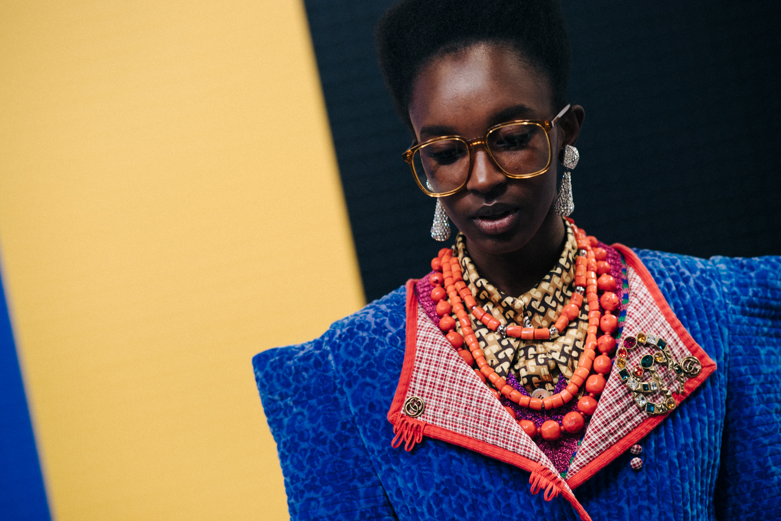 Closeup of black model in Gucci glasses