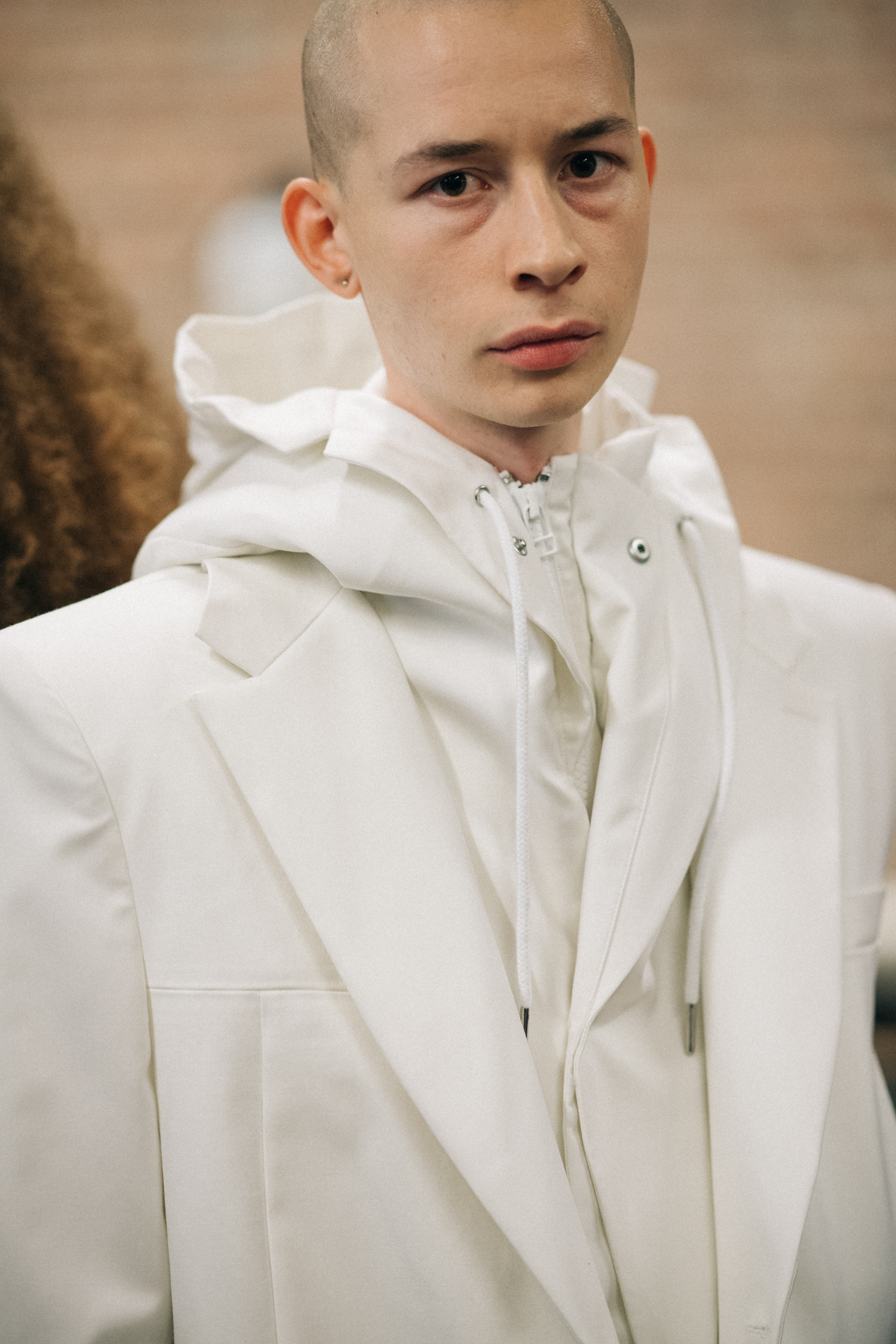 Male model wearing white suit