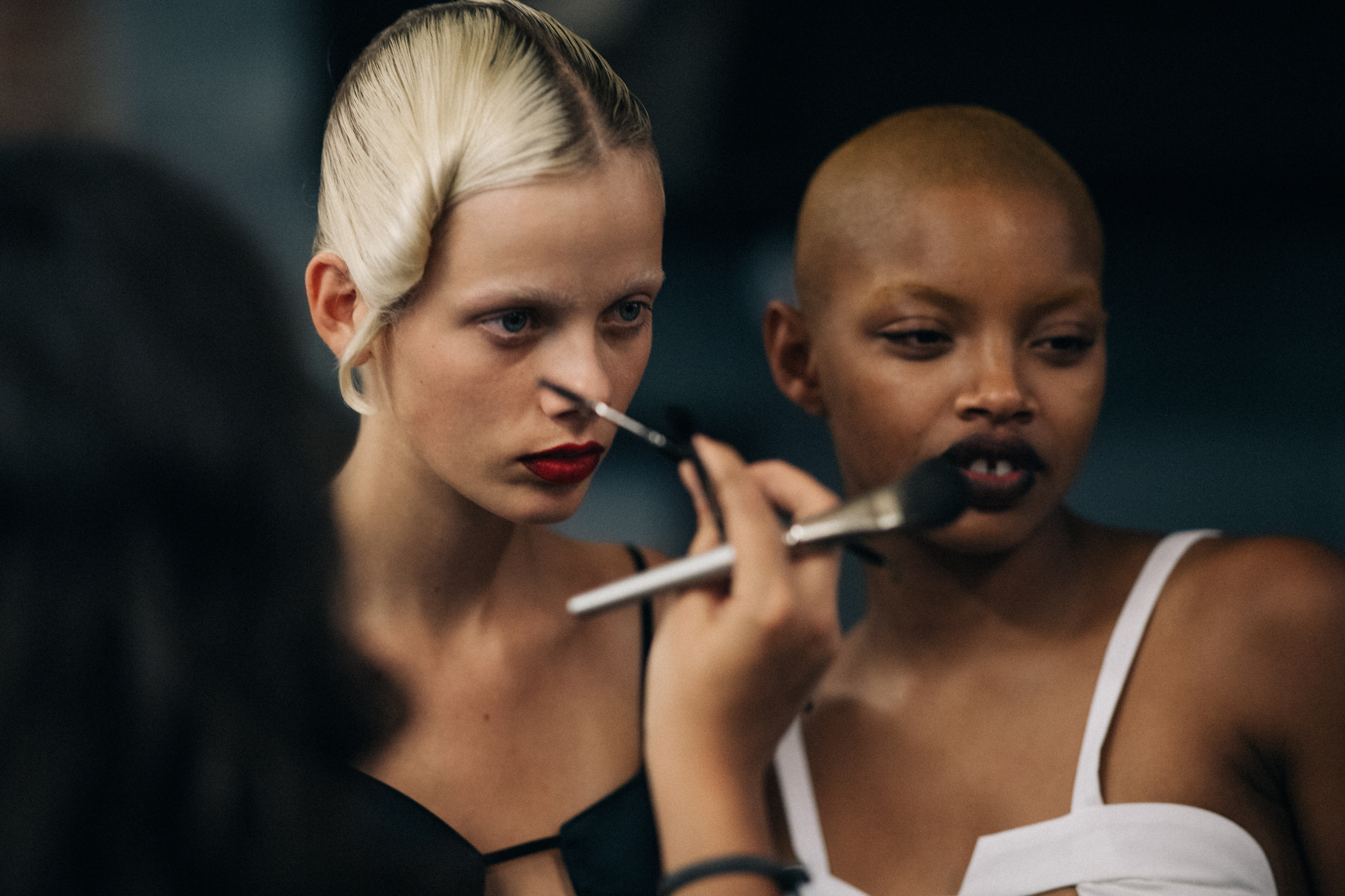 Model with teeth gap wearing black leather