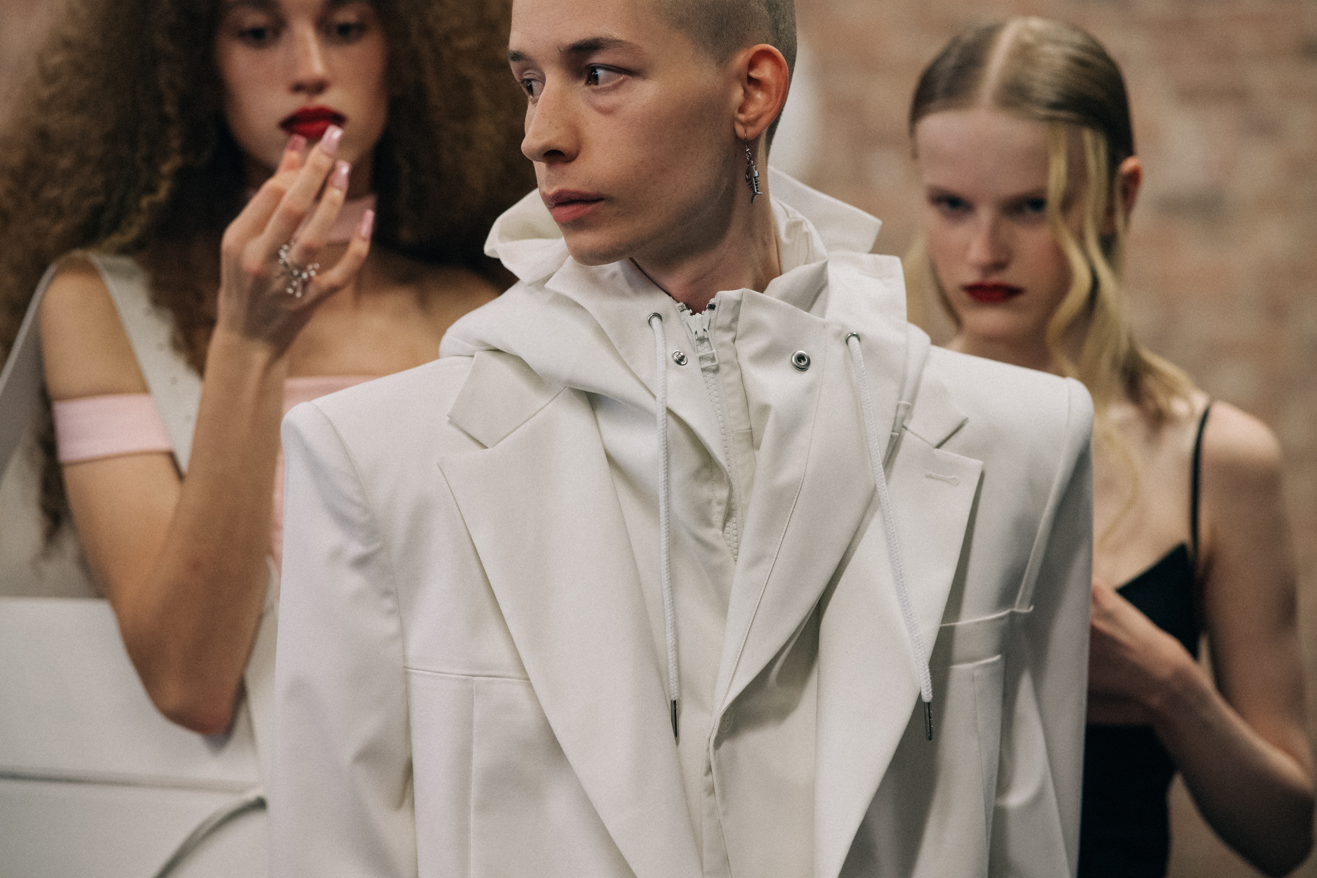 Male model wearing white suit