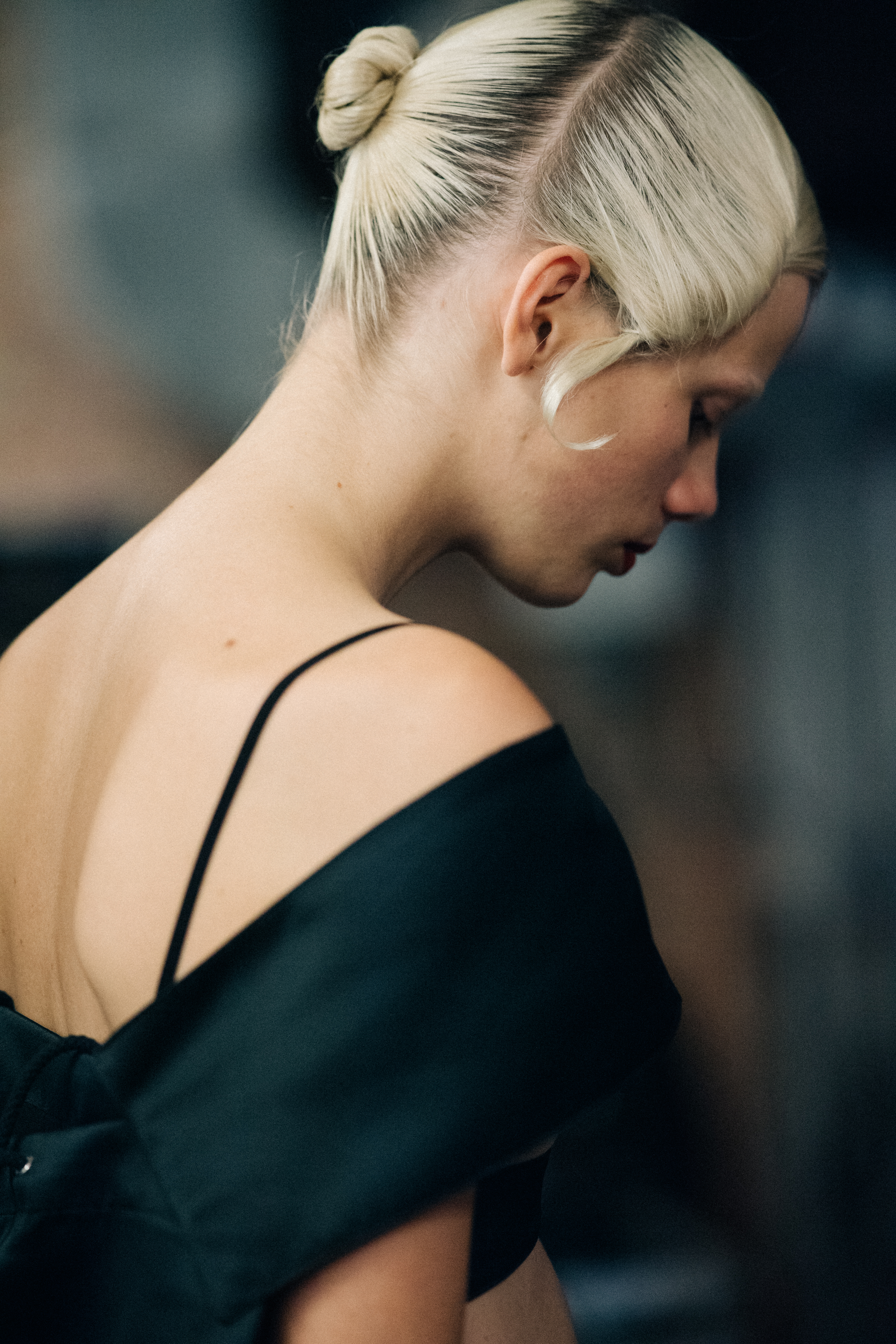 Dutch model wearing red lipstick and black suit