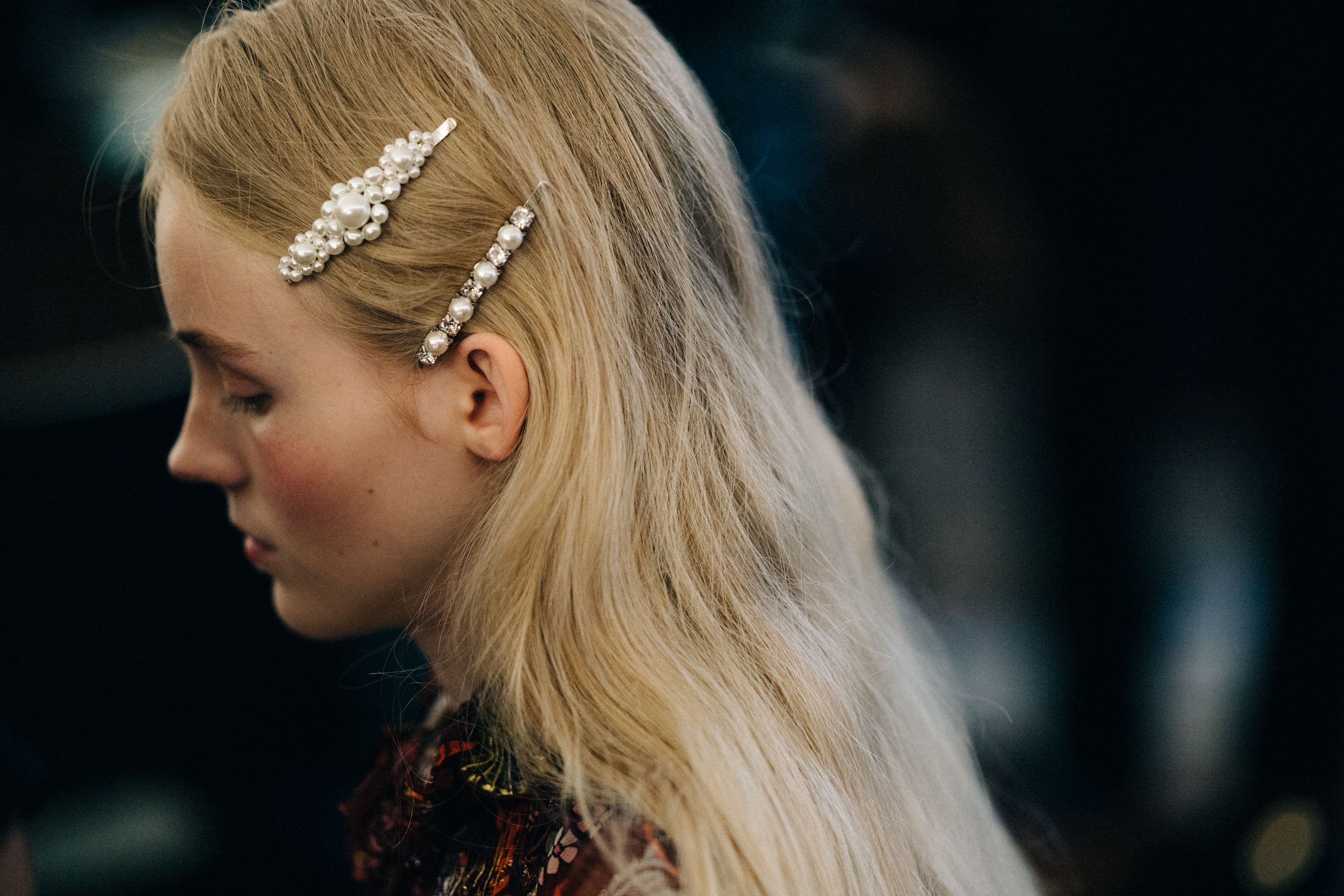 Model wearing pearl encrusted hair decorations