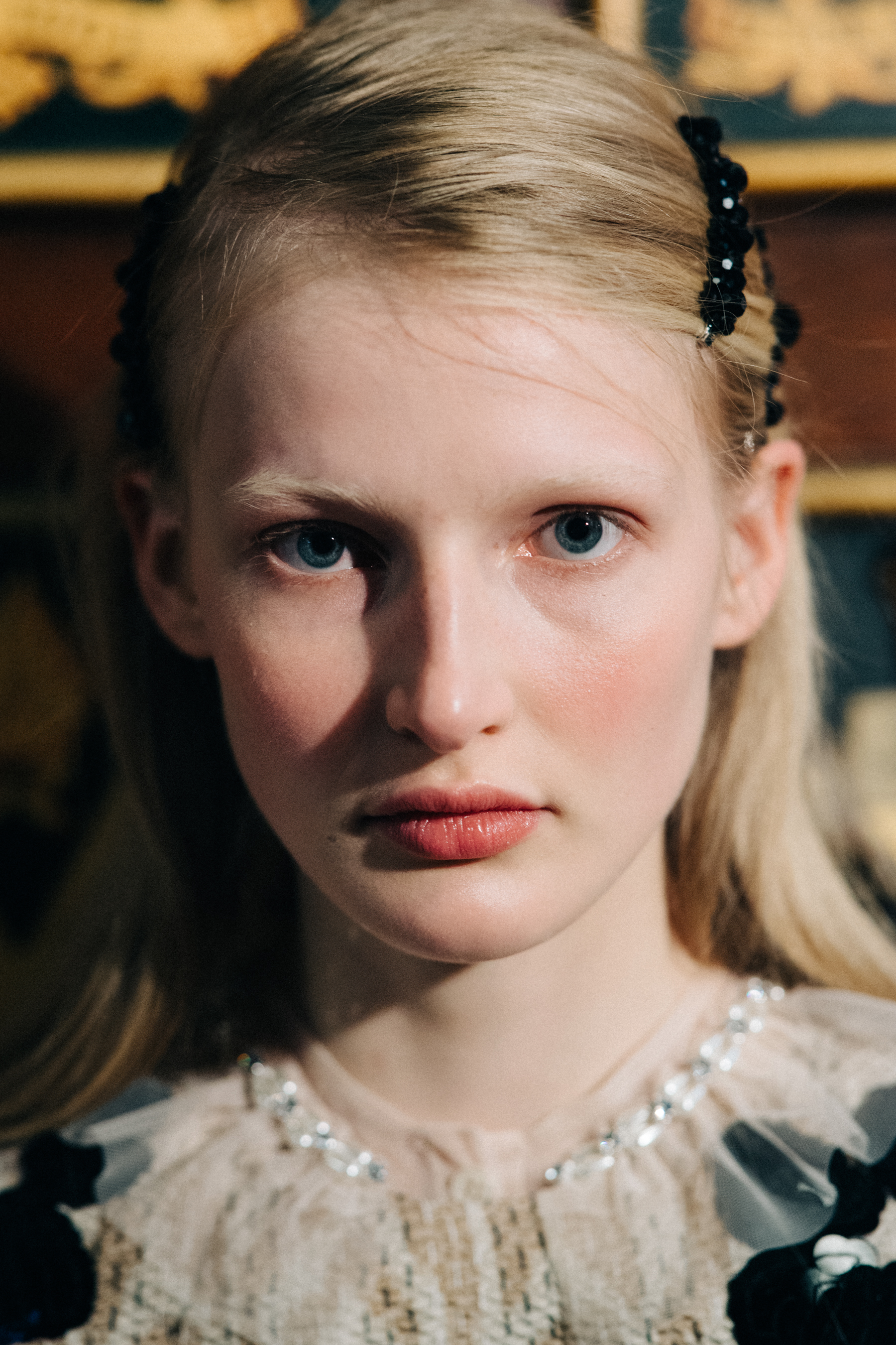 Model wearing pearl encrusted hair decorations
