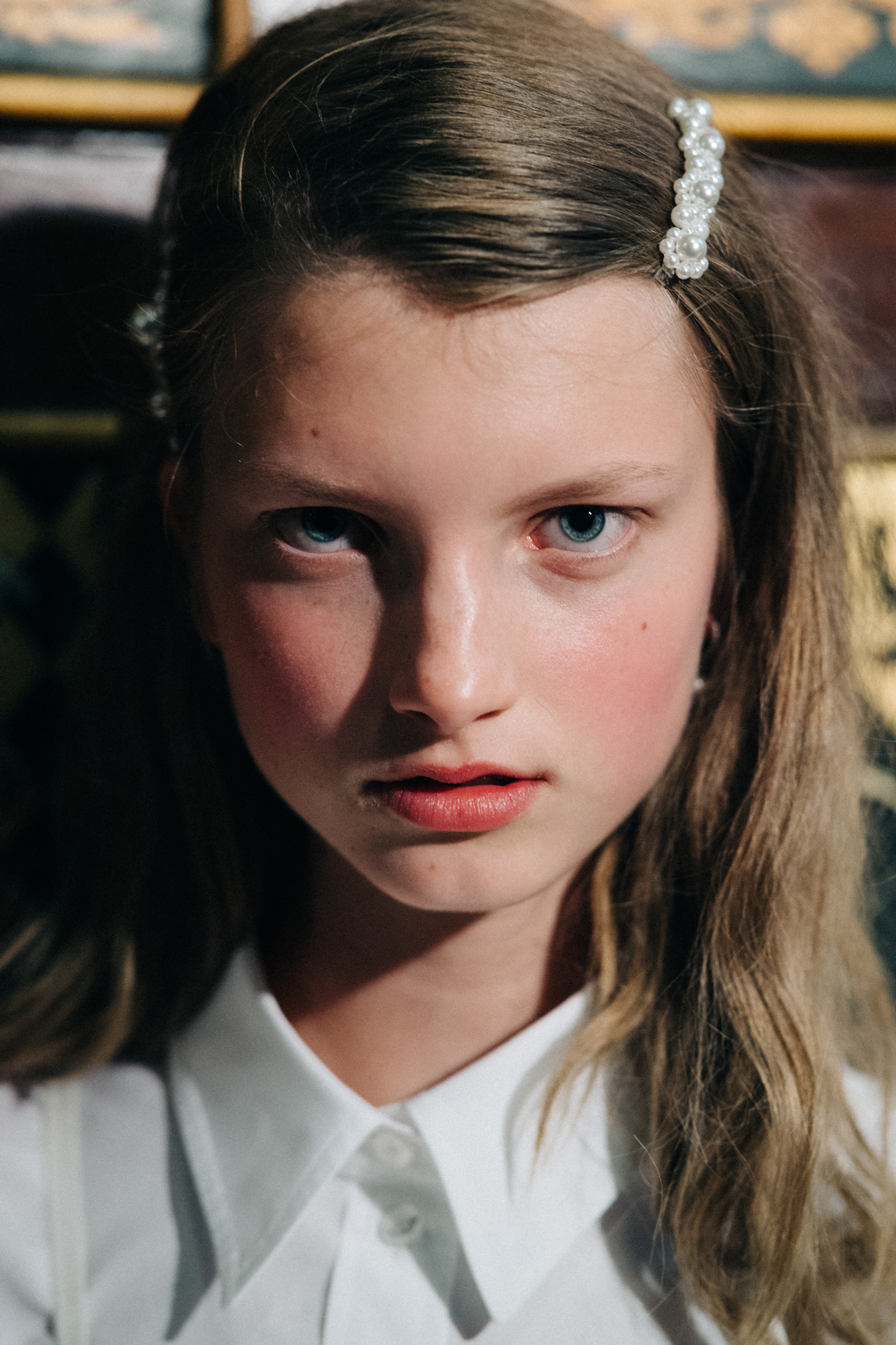 Model wearing pearl encrusted hair decorations