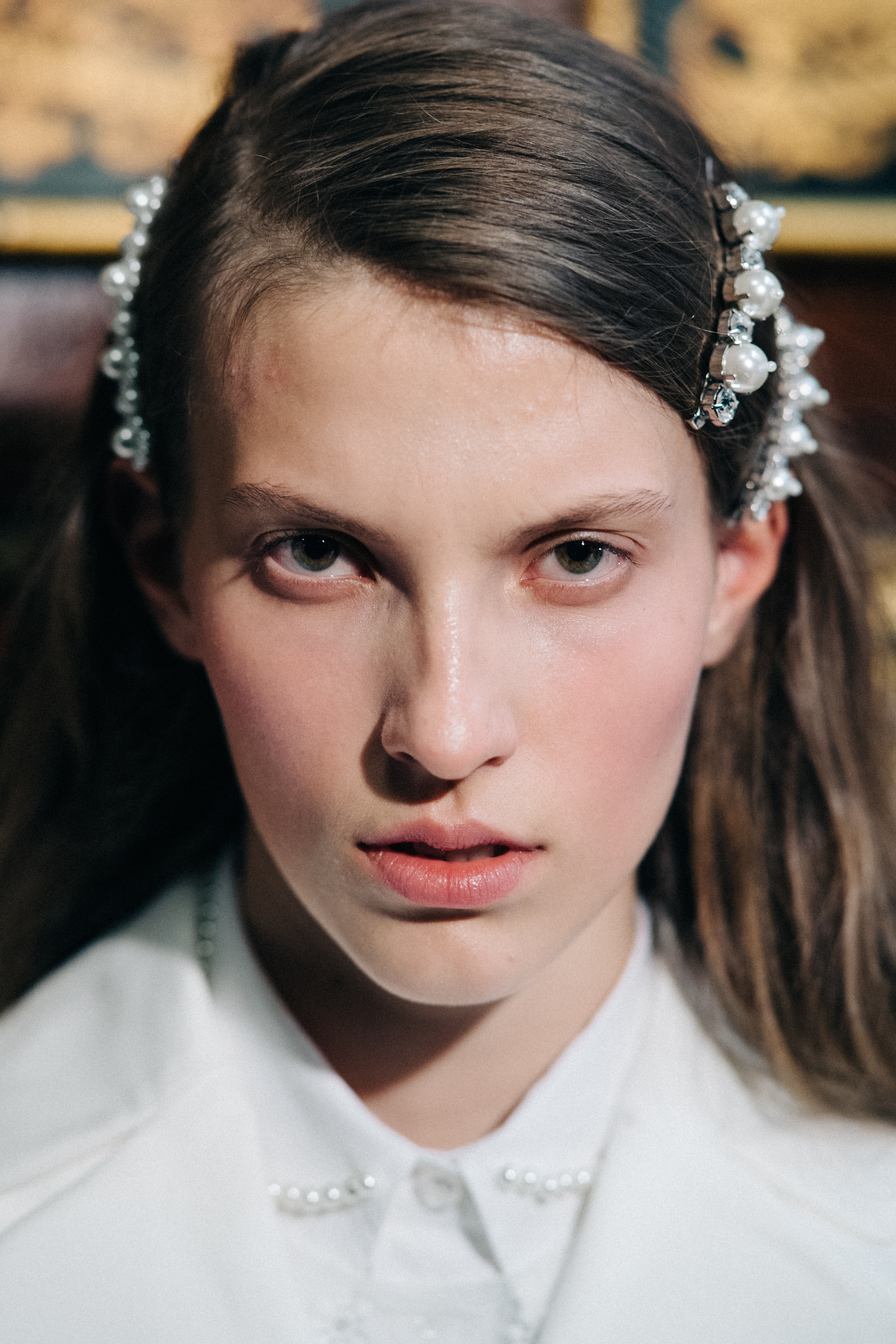 Model wearing pearl encrusted hair decorations